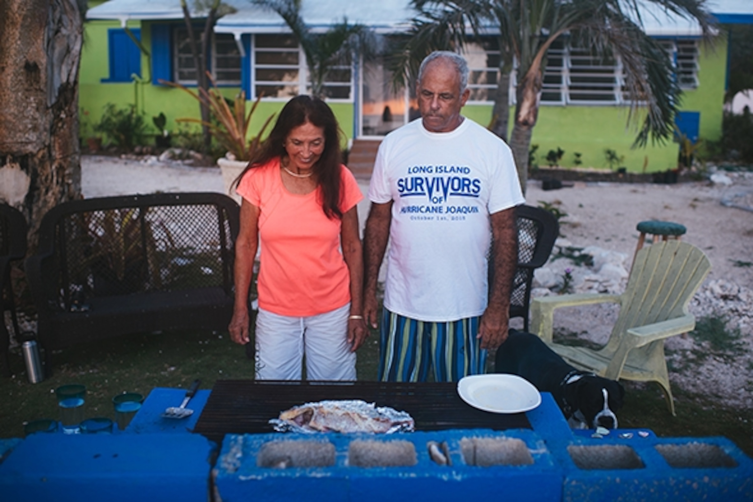 Charlie Beede and his wife cook dinner for the team at their house on Long Island in the Bahamas; Photograph by Max Lowe
