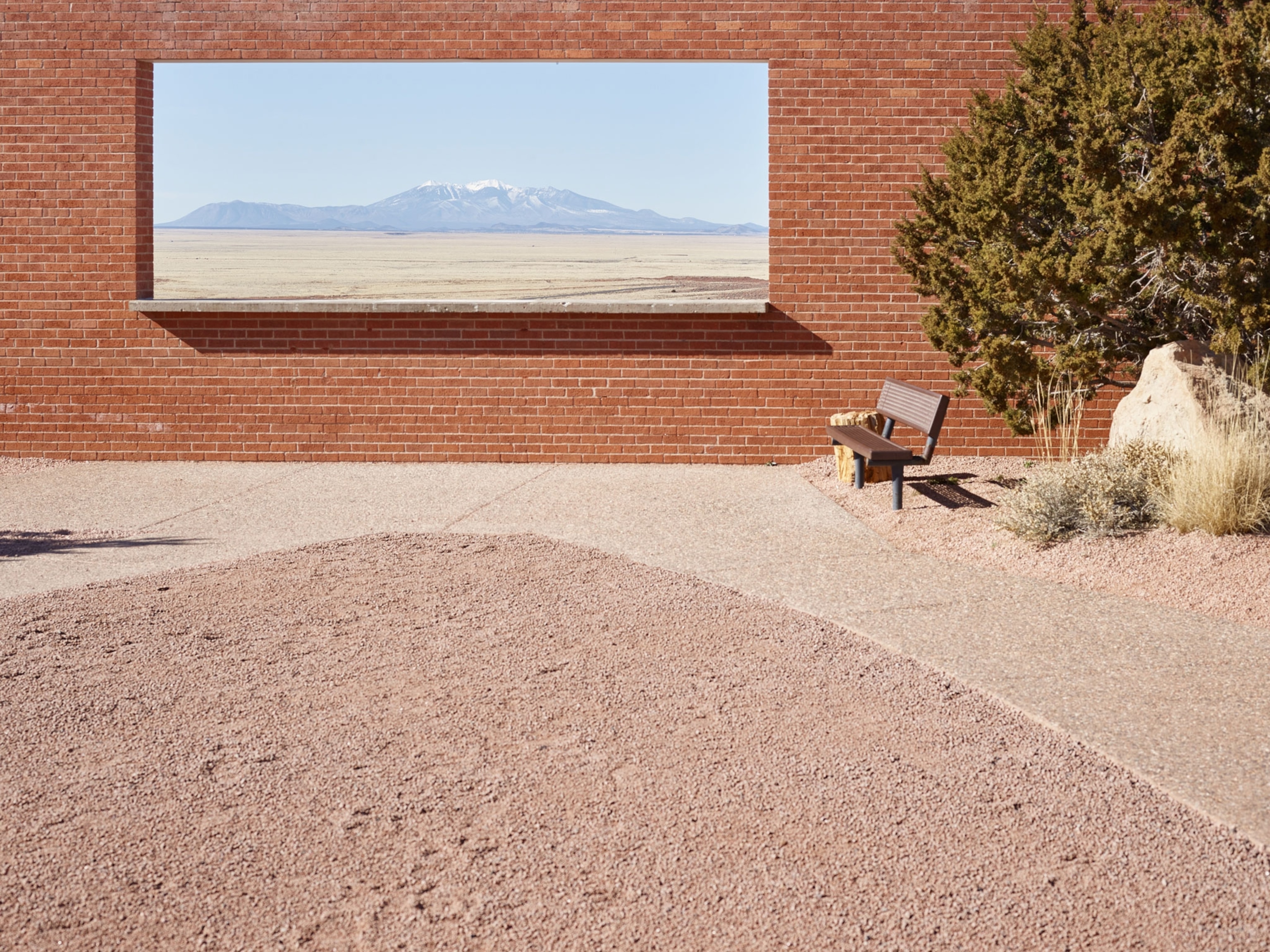 window cut in a brick wall overlooking Humphrey's Peak, Arizona