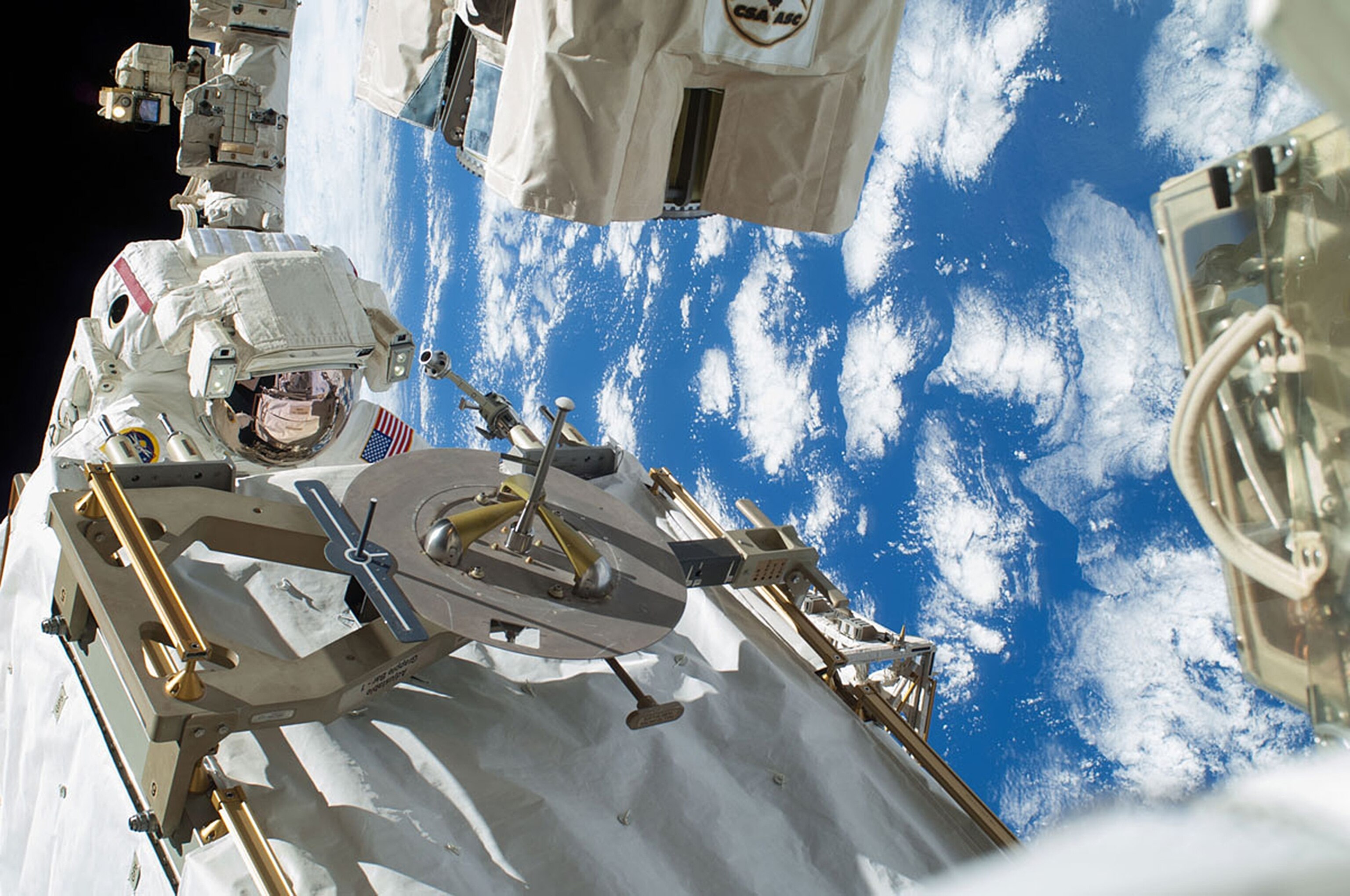 NASA astronaut Rick Mastracchio participates in the first Expedition 38 spacewalk designed to troubleshoot a faulty coolant pump on the International Space Station