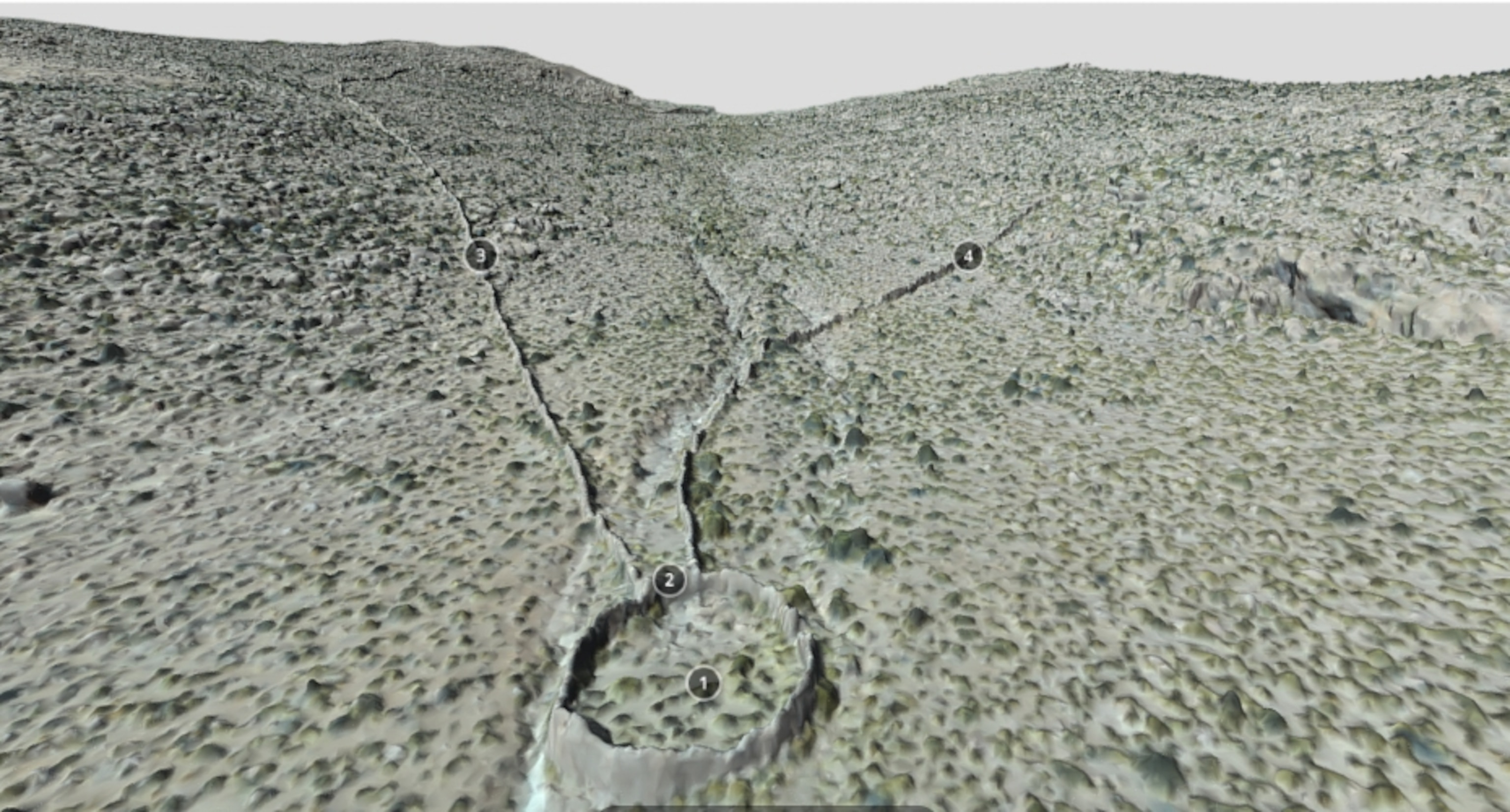 A 3D rending depicting stone walls forming a funnel down a mountain slope, towards a round stone corral