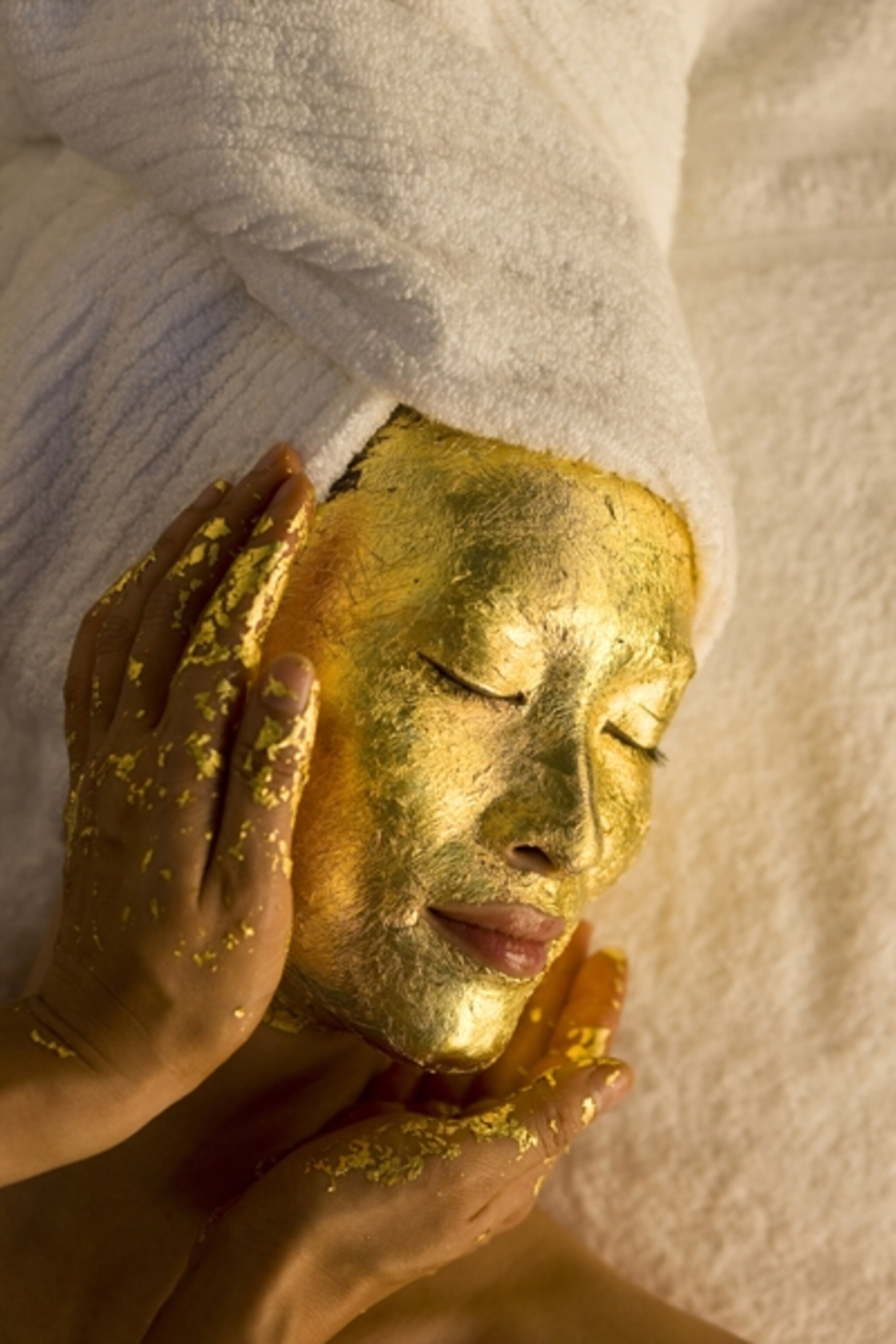 a model receiving a gold facial in New York