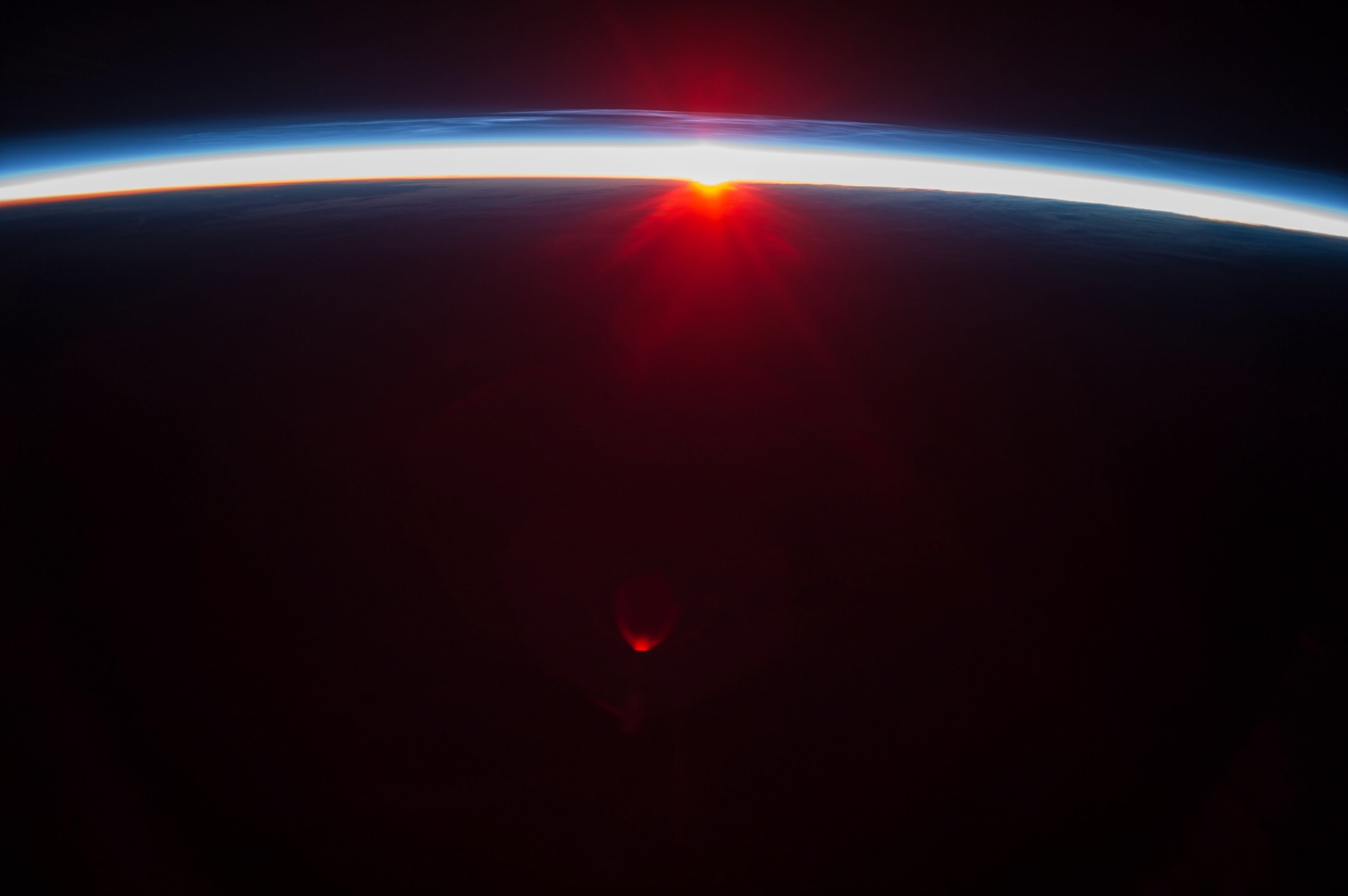 Sunset over the Aleutian Islands, with Noctilucent Clouds.