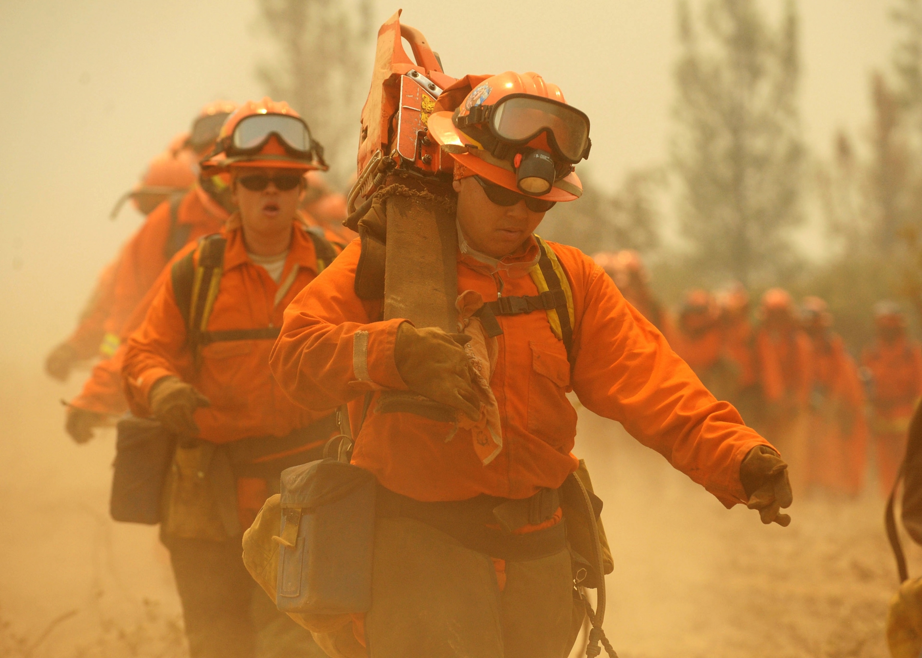 Women inmate firefighters hike to cut fireline on the Telegraph Fire near Yosemite National Park Wednesday, July 30, 2008, near Mariposa, Calif.