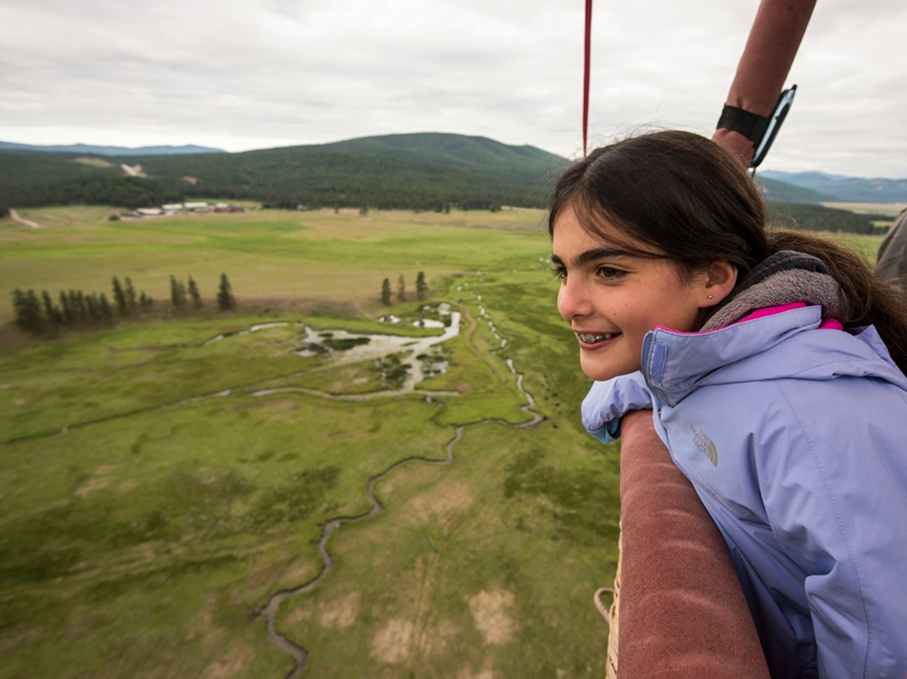 a hot air balloon over the Blackfoot River in Greenough, Montana