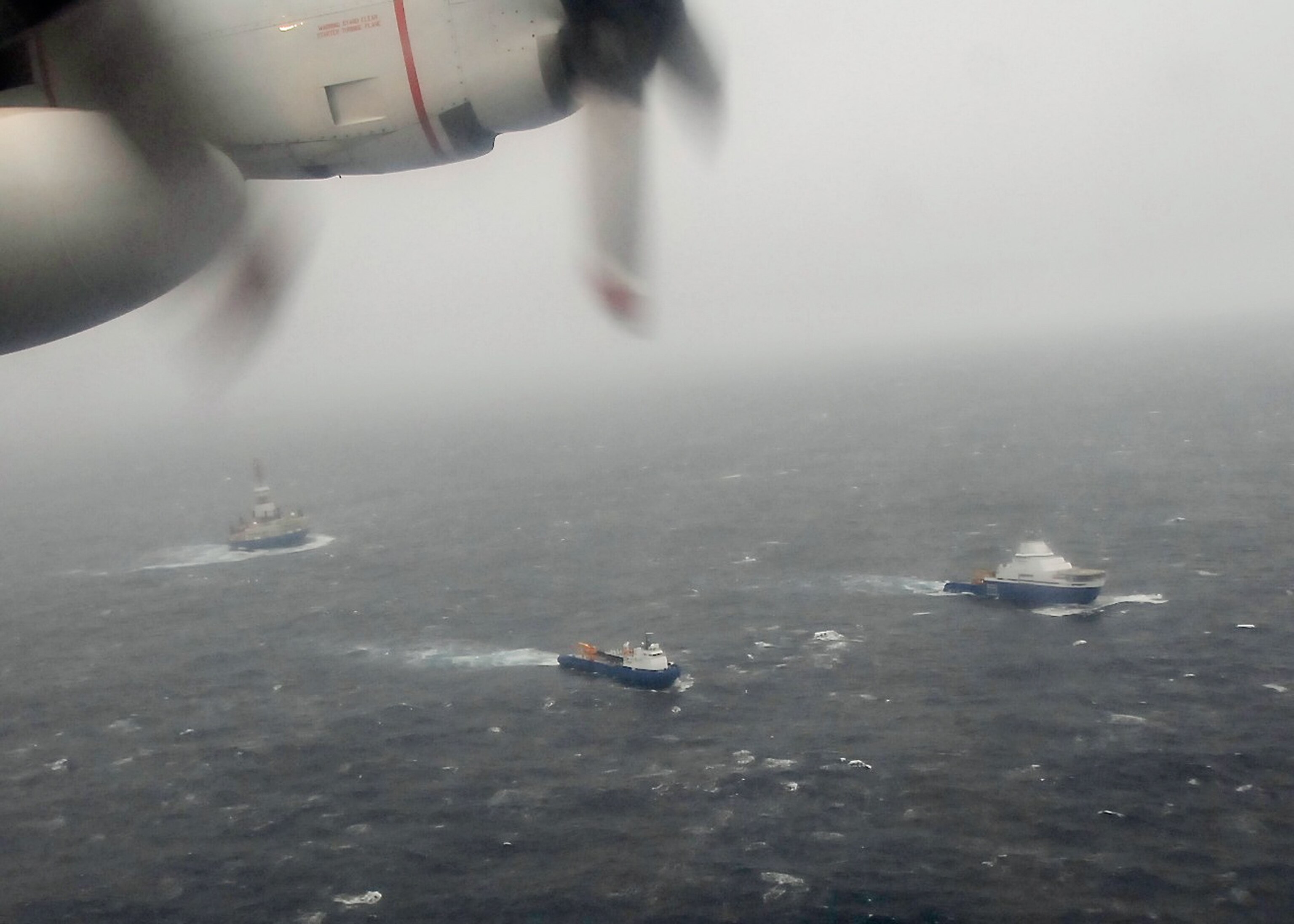 The oil drilling rig Kulluk with the tow ship Aiviq and spill response vessel Nanuq, seen from a Coast Guard overflight on December 30, 2012
