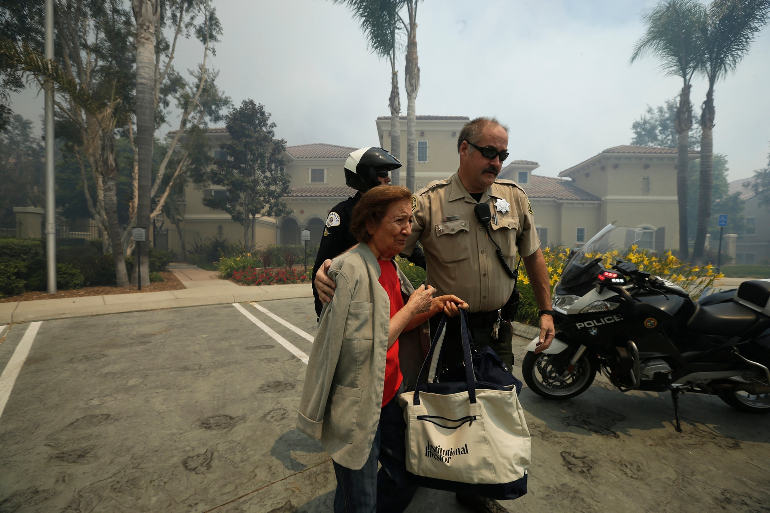 Wildfire climbs a canyon toward homes Wednesday, May 14, 2014, in Carlsbad, Calif.