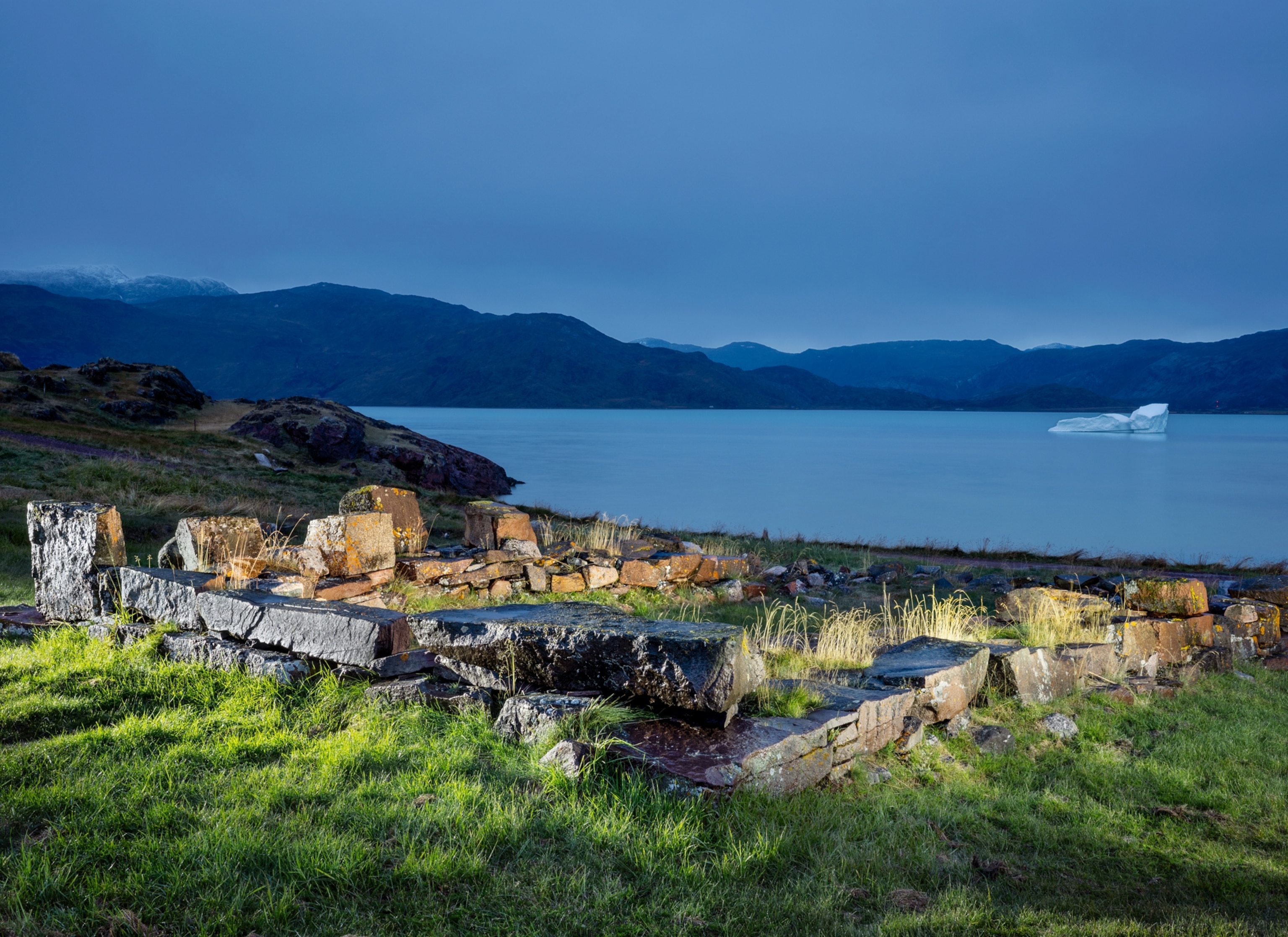 View of the ruins of dwelling, barns and church.