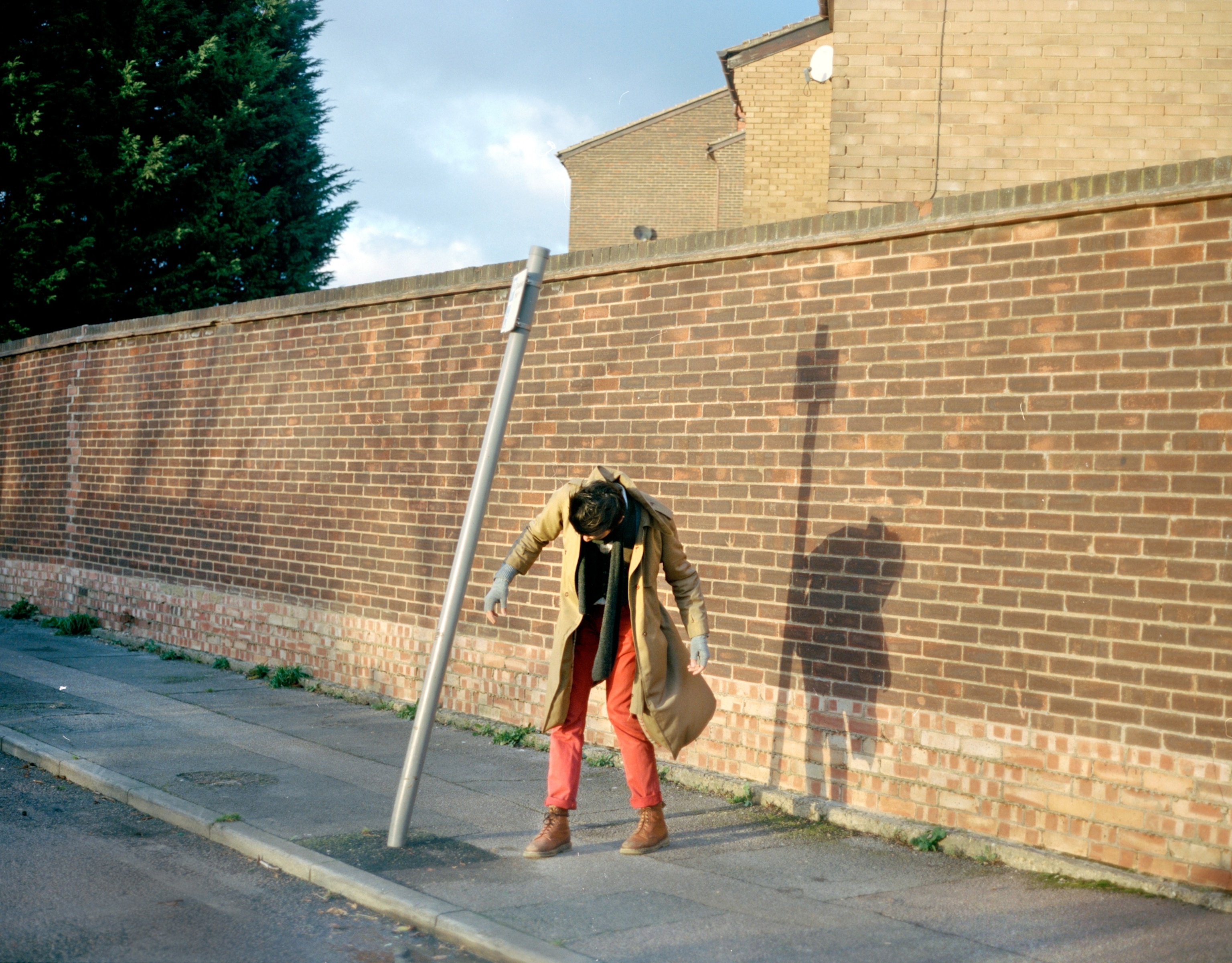 woman bending over near sign