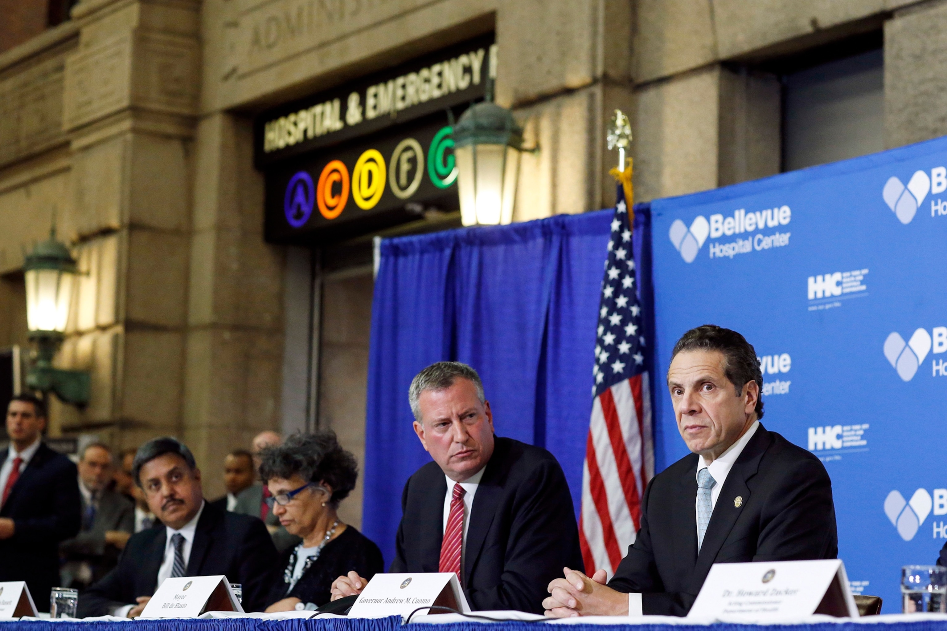 Dr. Steven Hatch checks his protective gear in a mirror before entering a high-risk ward at an Ebola clinic run by the International Medical Corps near in Suakoko, Liberia, Oct. 13, 2014.
