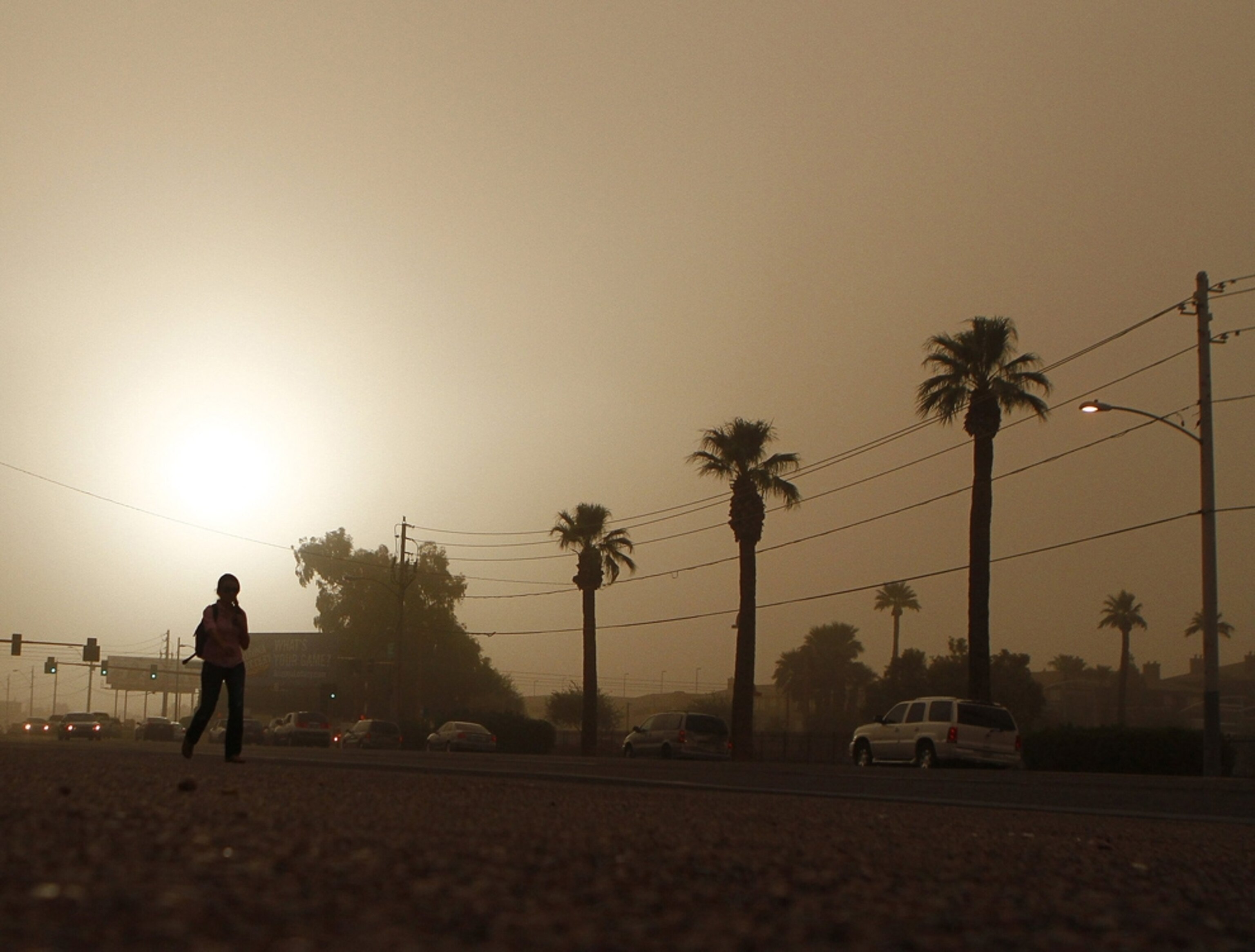 a person walking through a dust storm in Arizona