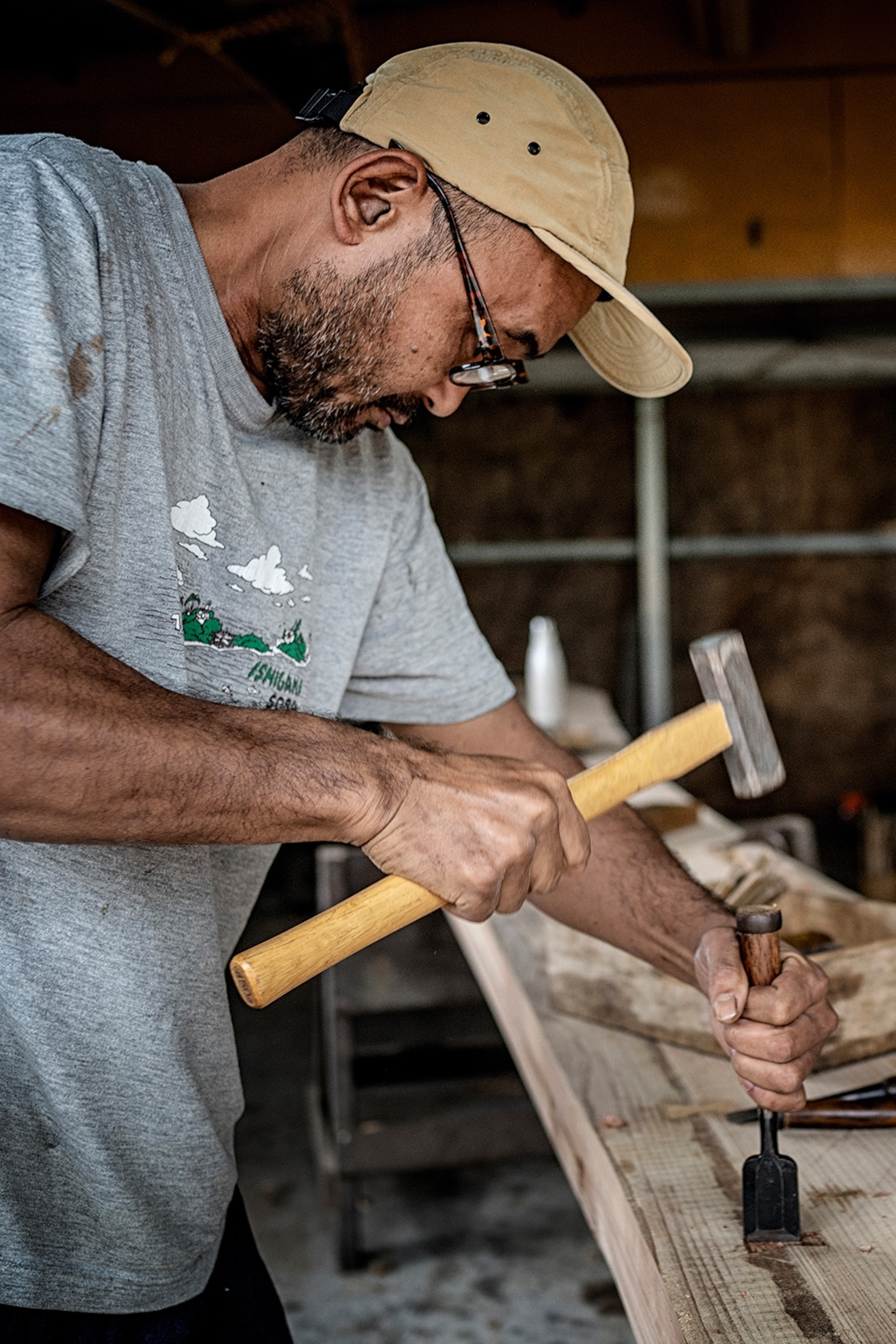 Boat-builder Yoshida Tomohiro carving a new sabani boat.