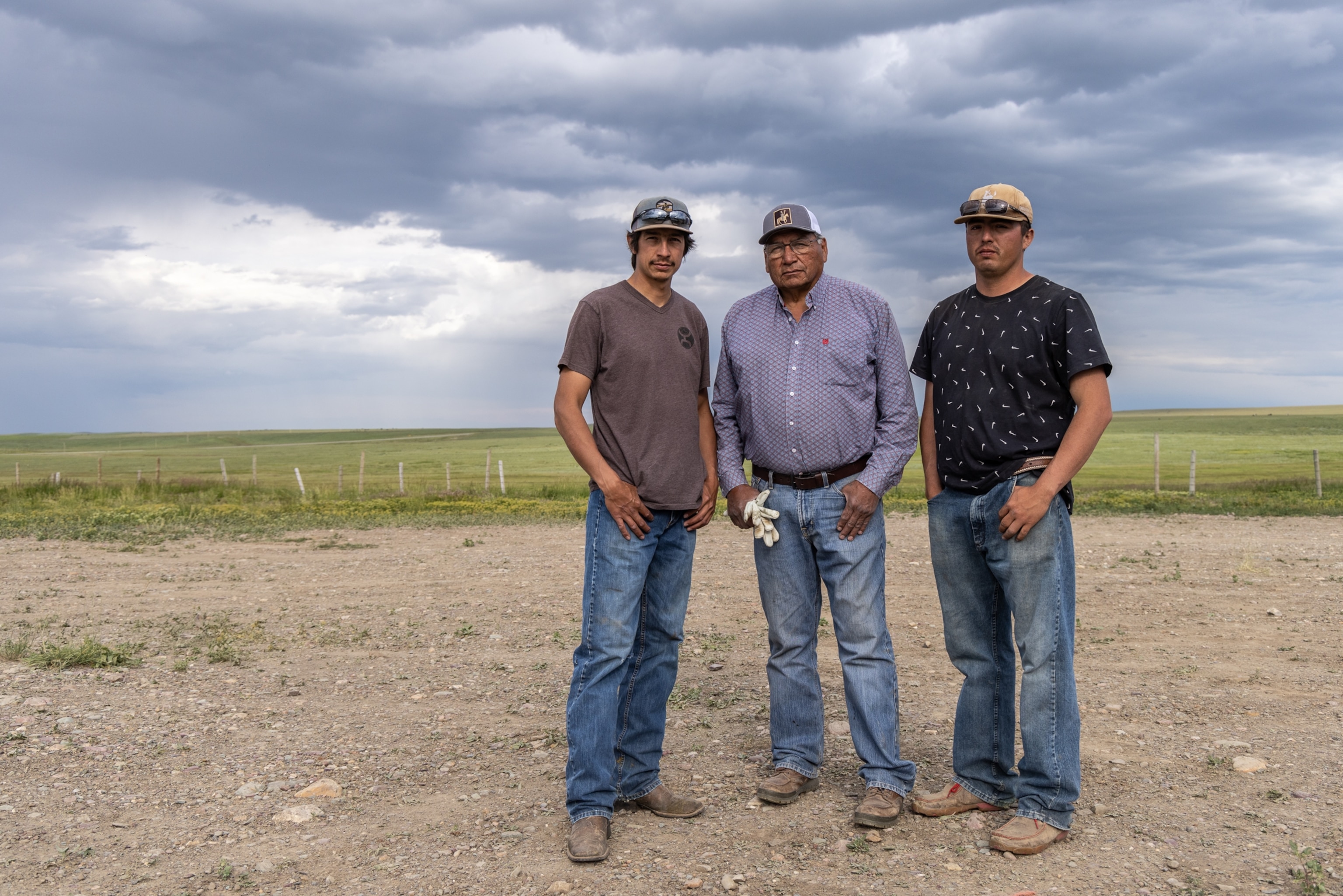 Chazz Raccine, Ervin Carlson and Josh Monroe of the Blackfeet Buffalo Program stand for a portrait