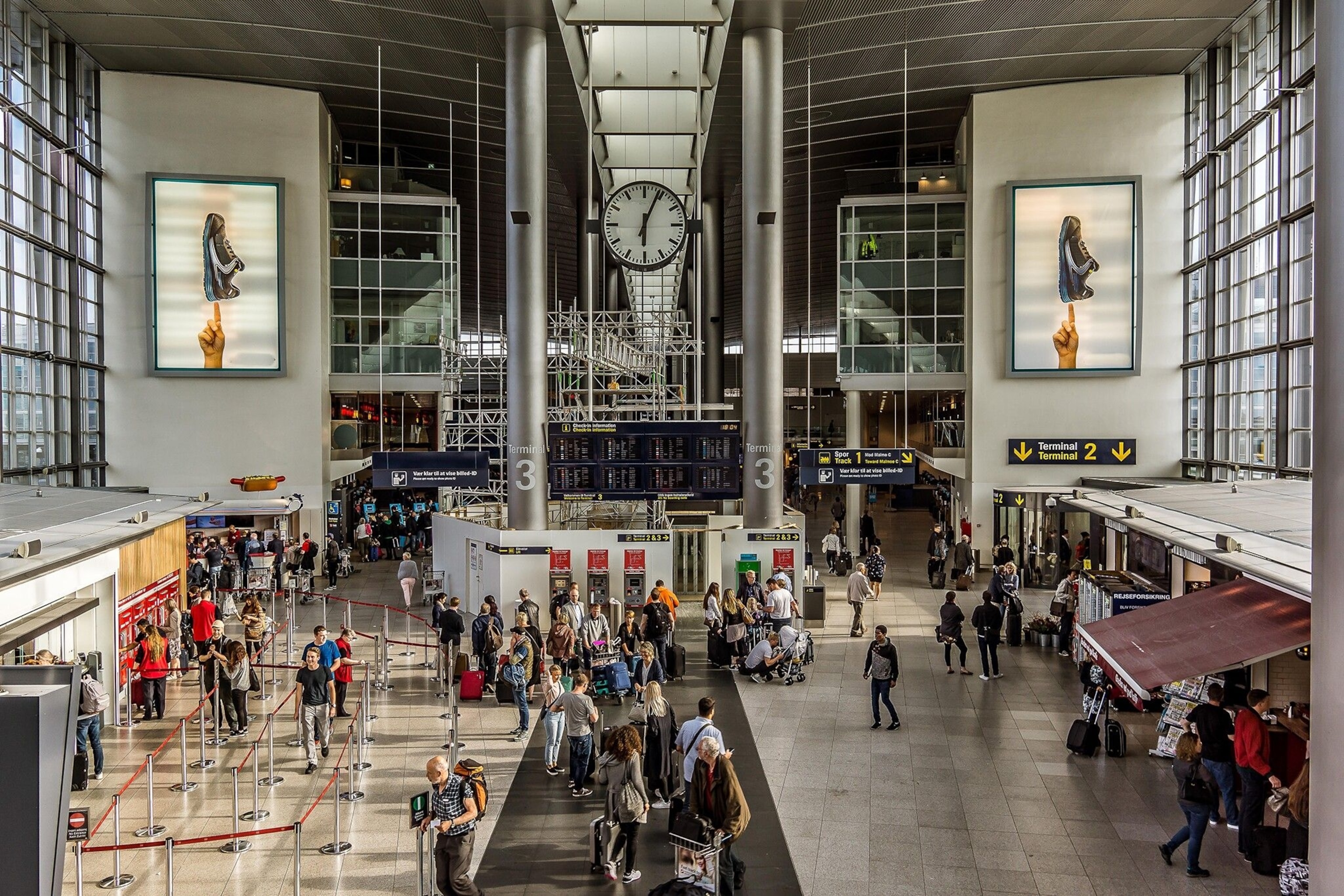 Travellers checking in at Copenhagen Airport.
