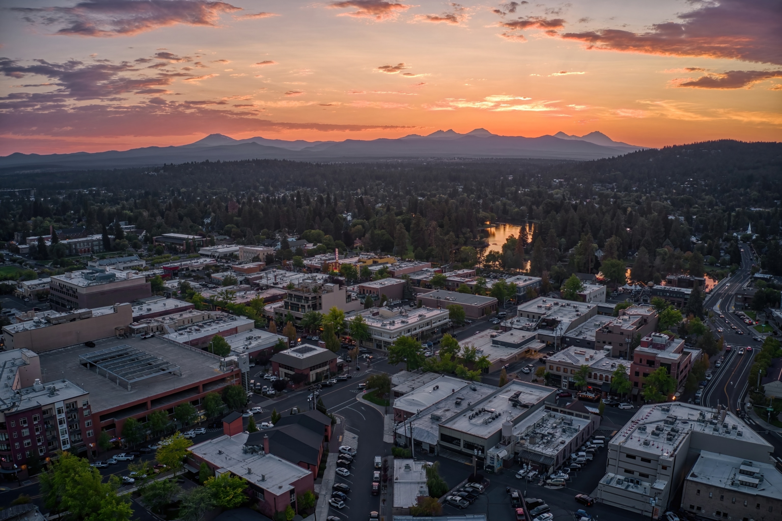 A aerial view of the sunset over a small town.
