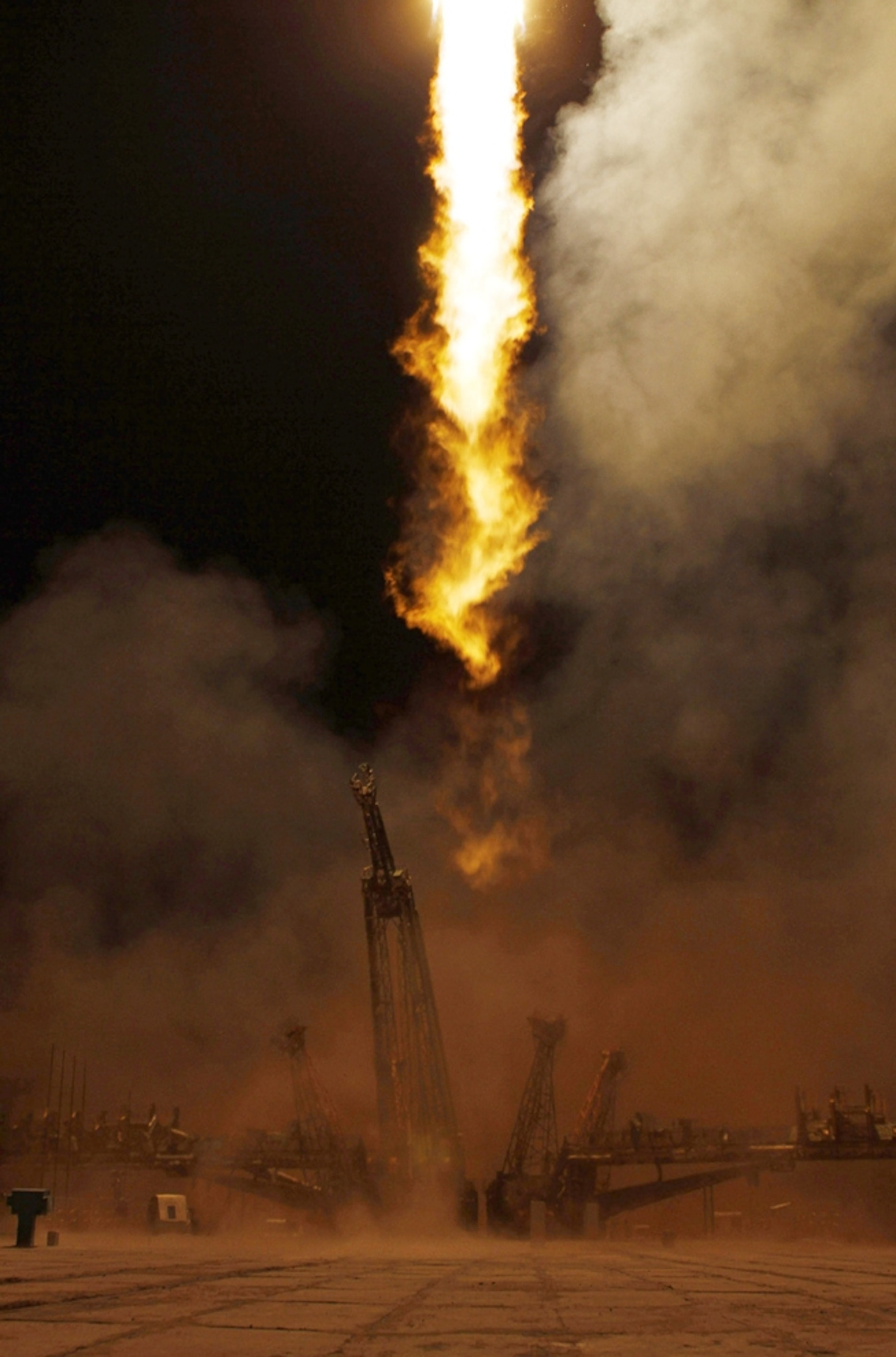 Picture of a Russian Soyuz craft lifting off from Kazakhstan.