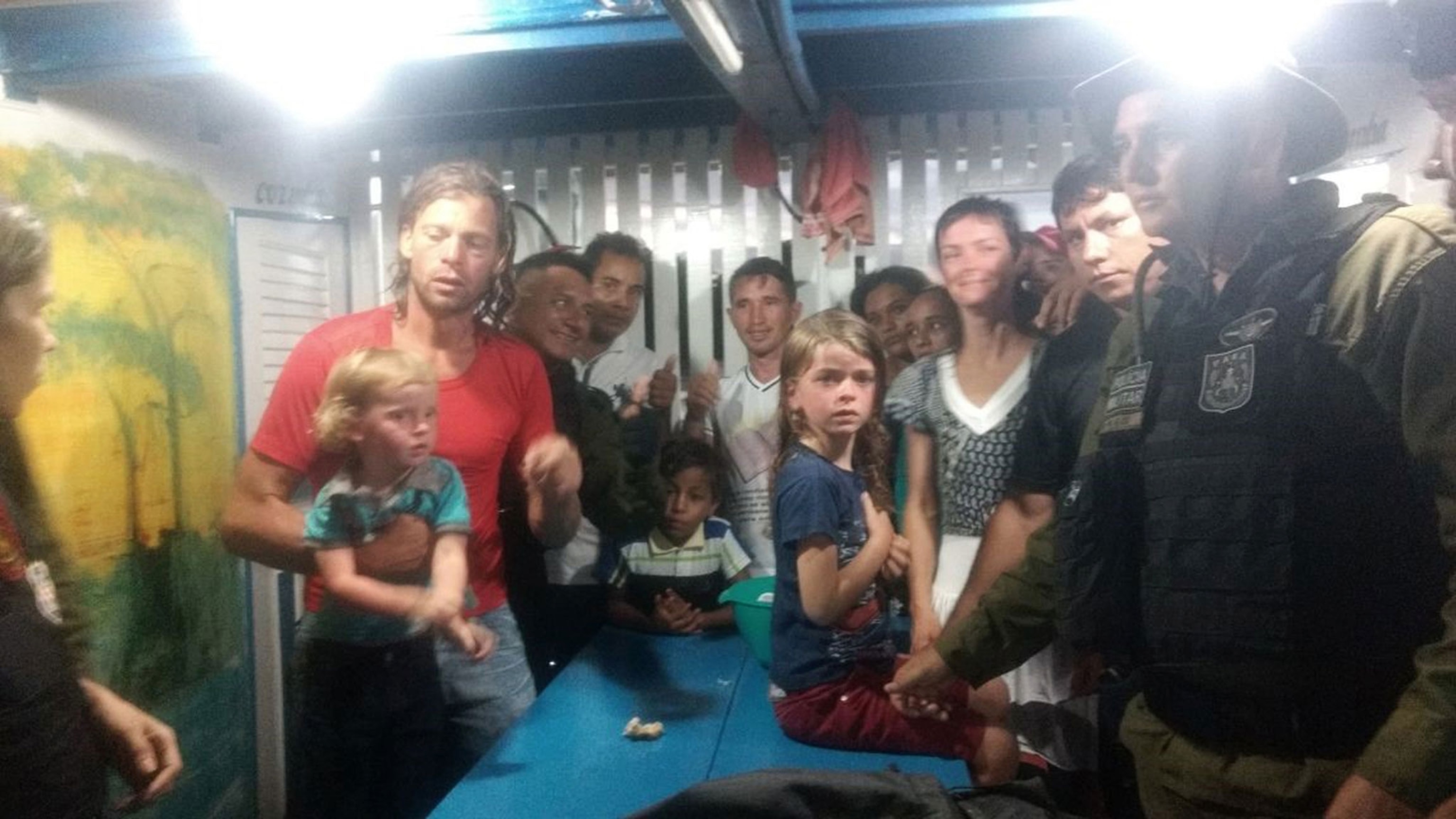 a family safe after being robbed by pirates on the Amazon river in Brazil