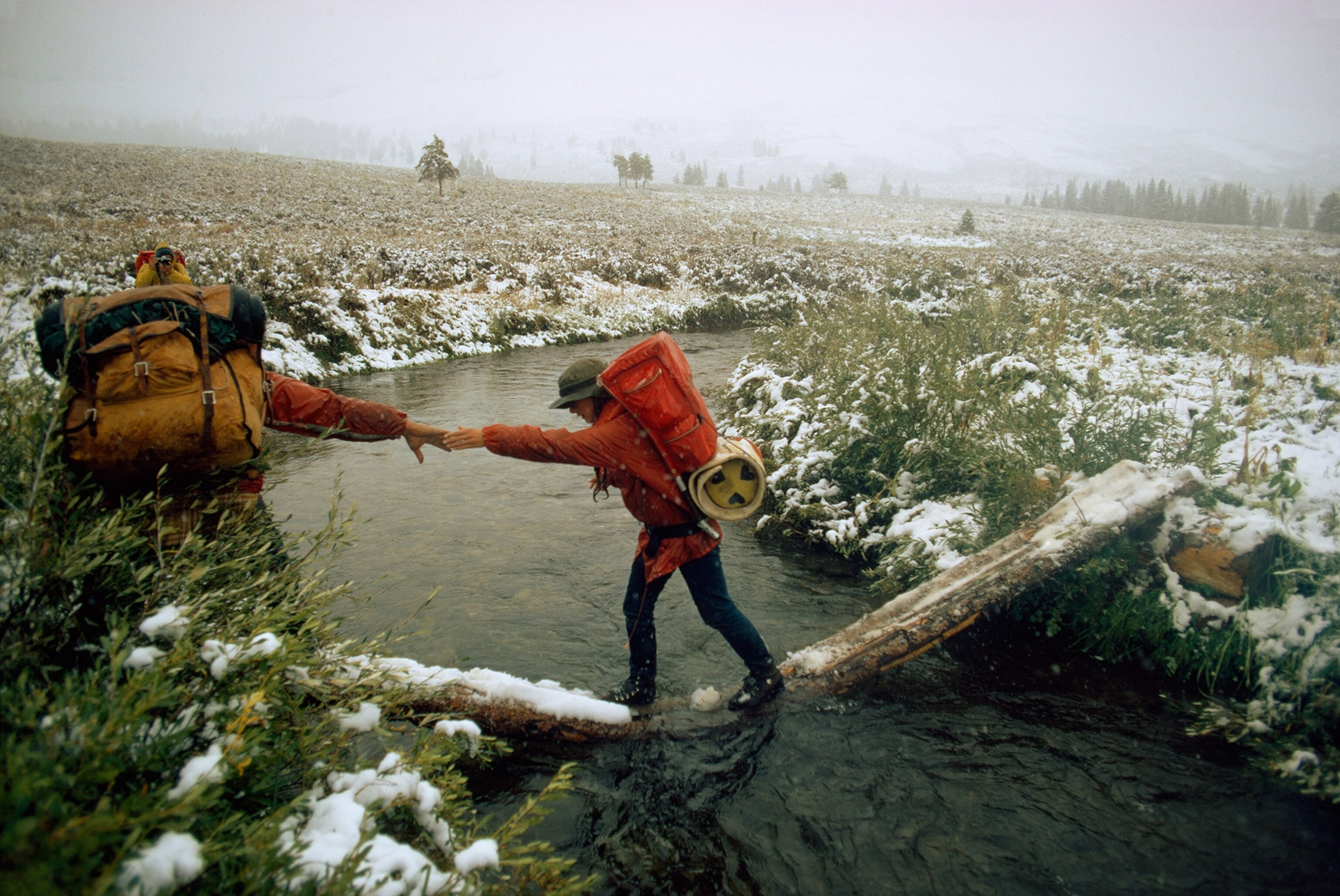 hikers crossing waters