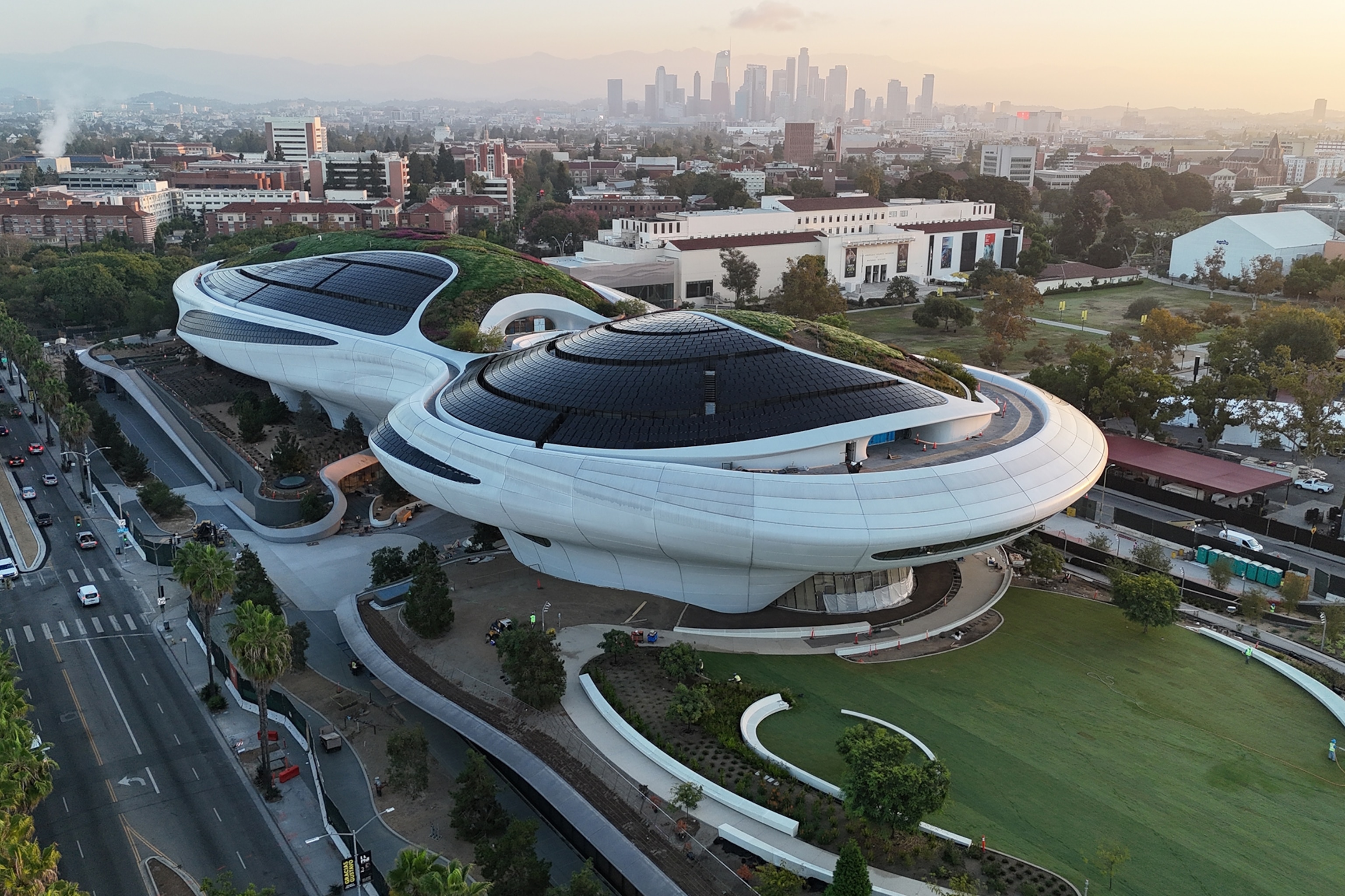 An aerial shot of a spaceship-like museum in a park.