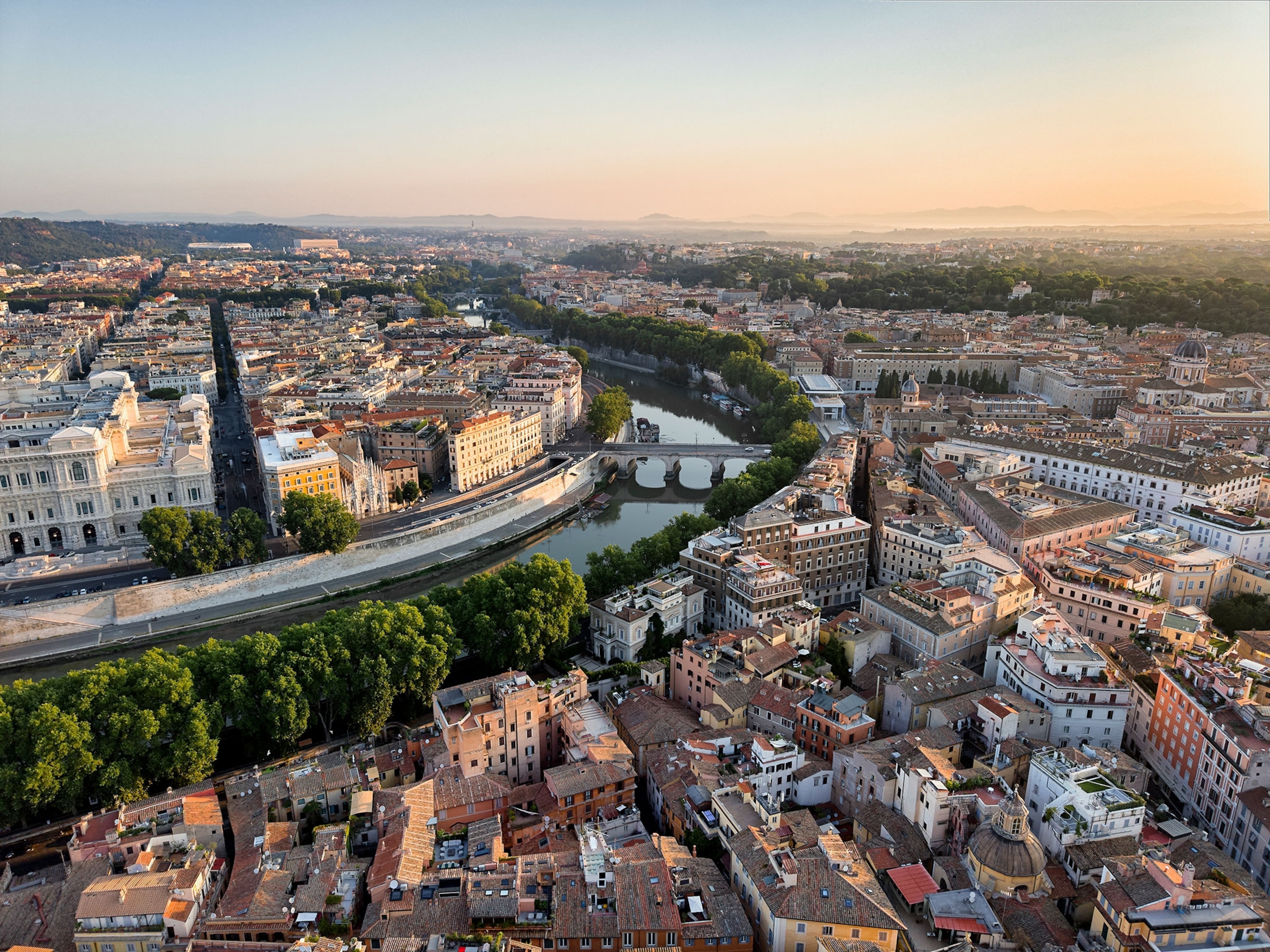 Rome cityscape and Tiber river at Sunset, Italy.