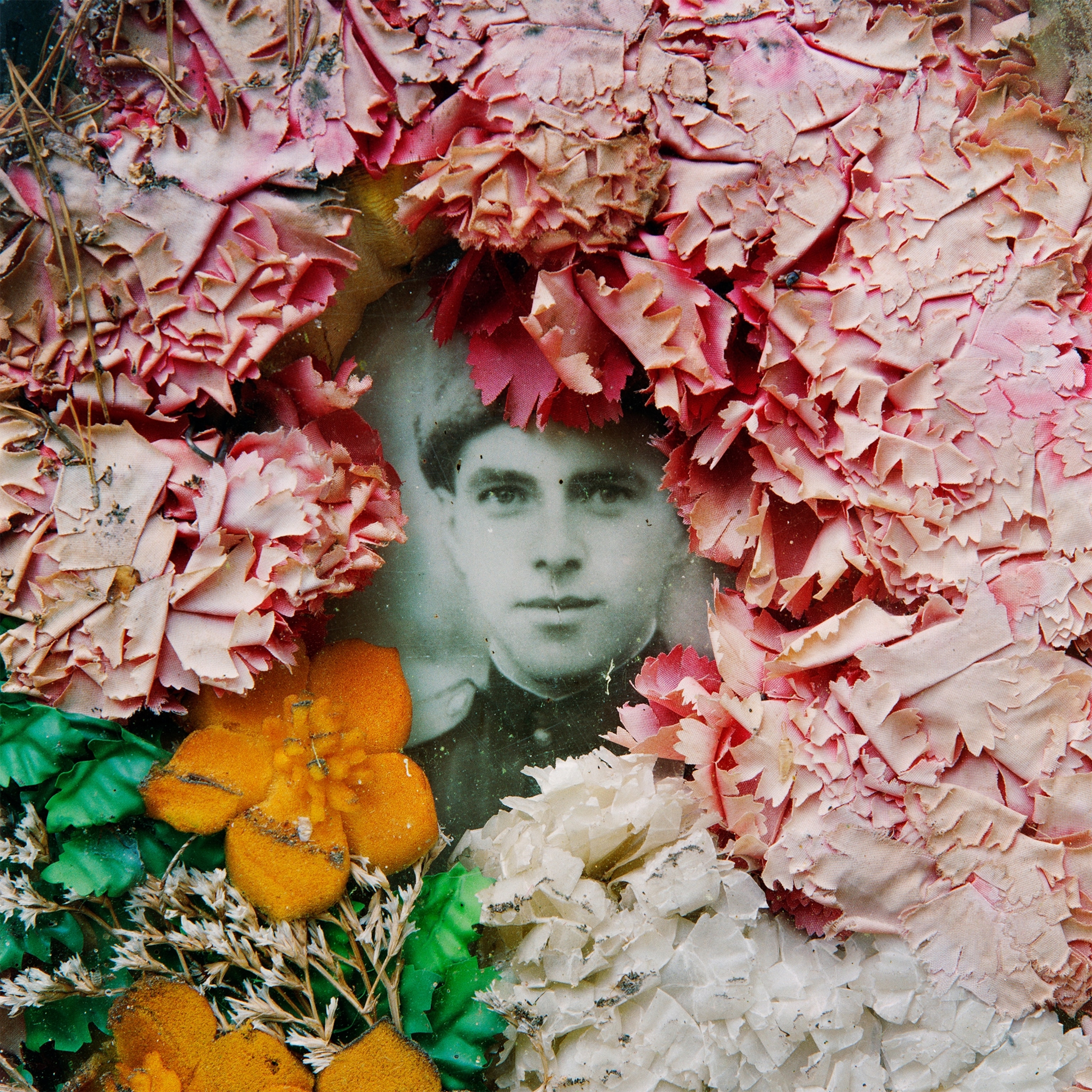 a Russian soldier on his gravestone in a Soviet army cemetery dating from the Cold War.