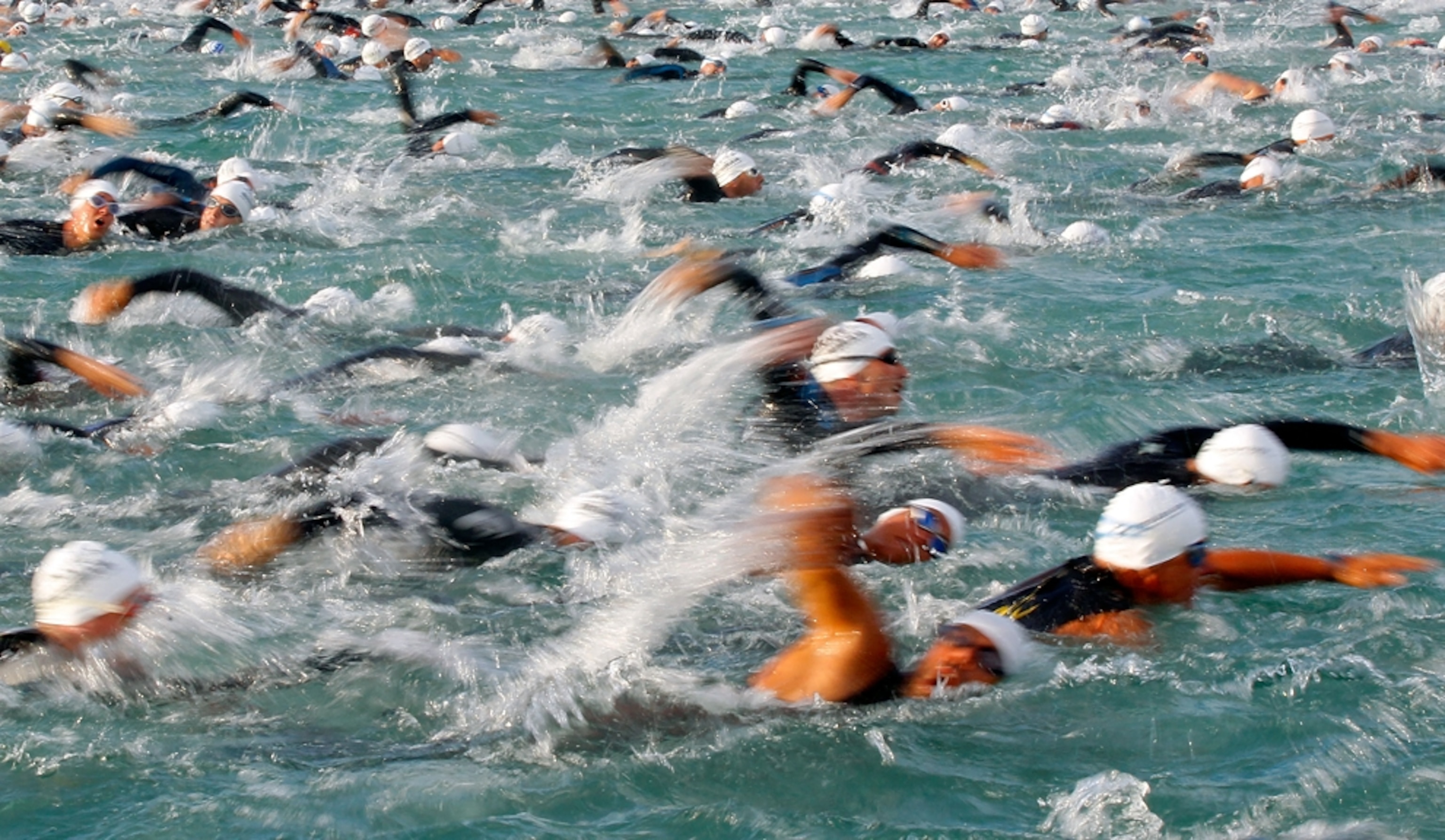 Competitors swim during the Ironman Austria Triathlon race in Klagenfurt July 3, 2011.