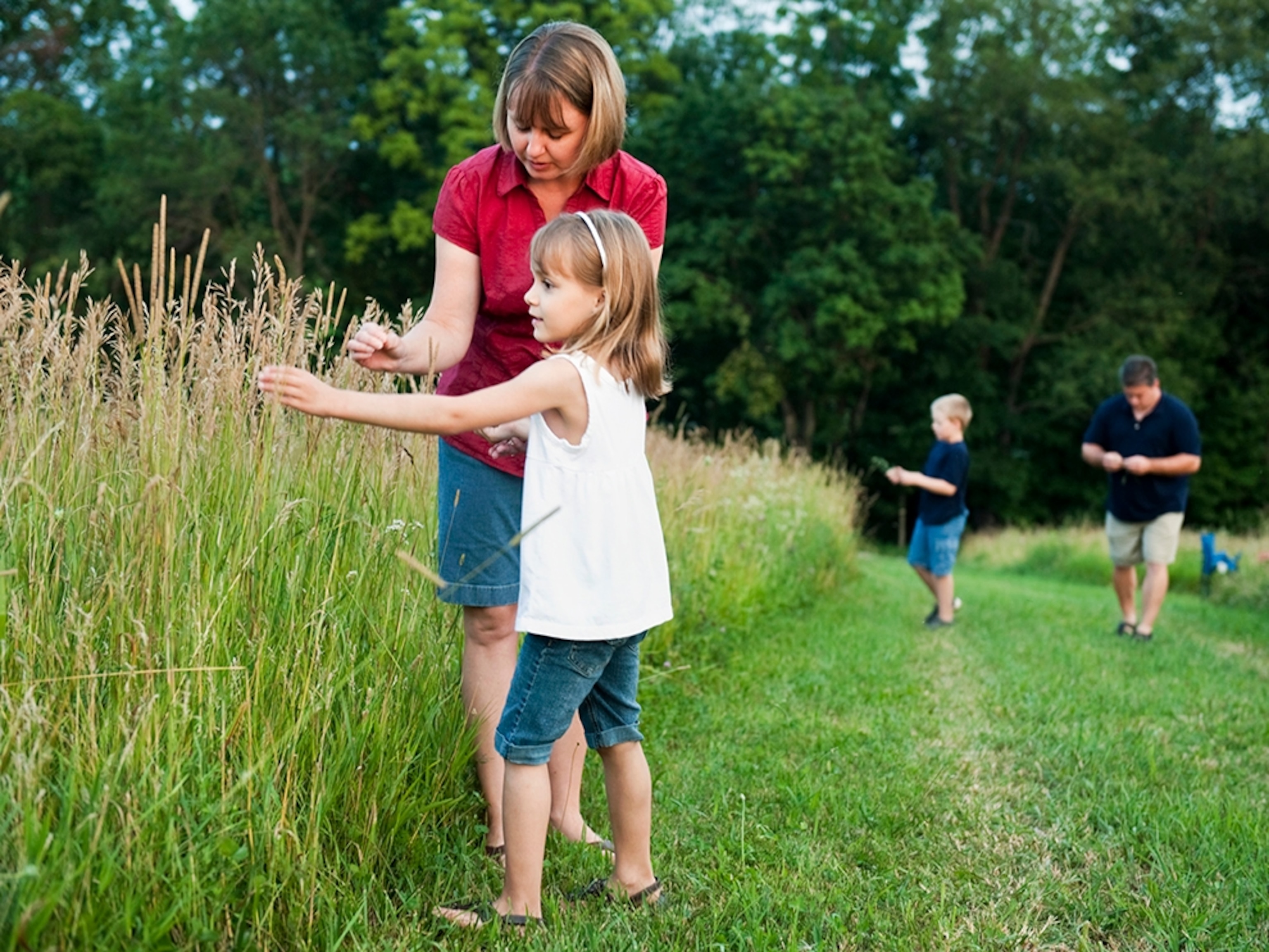 The Hallowiches on the grass outside their home.