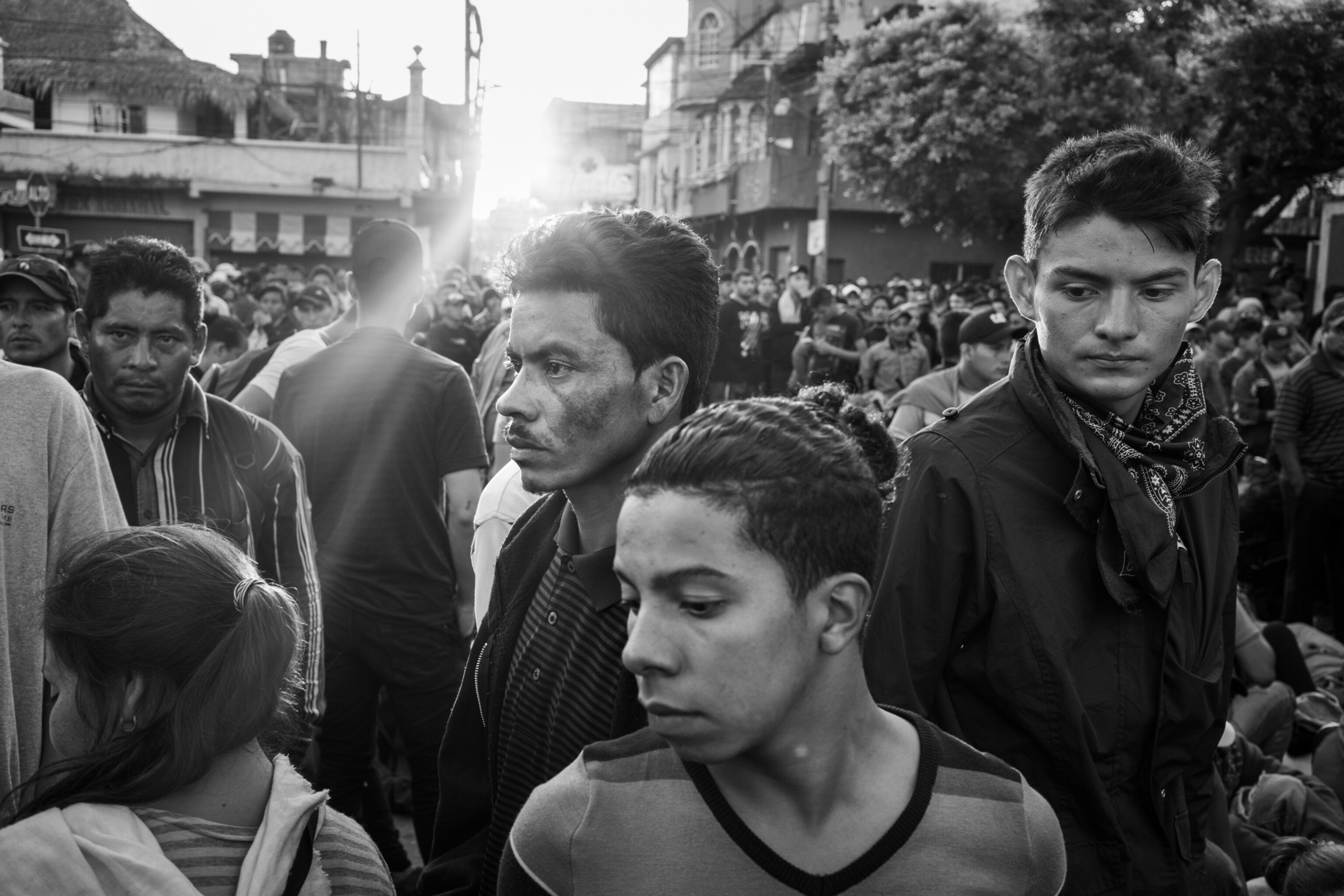 a group of young men outside waiting