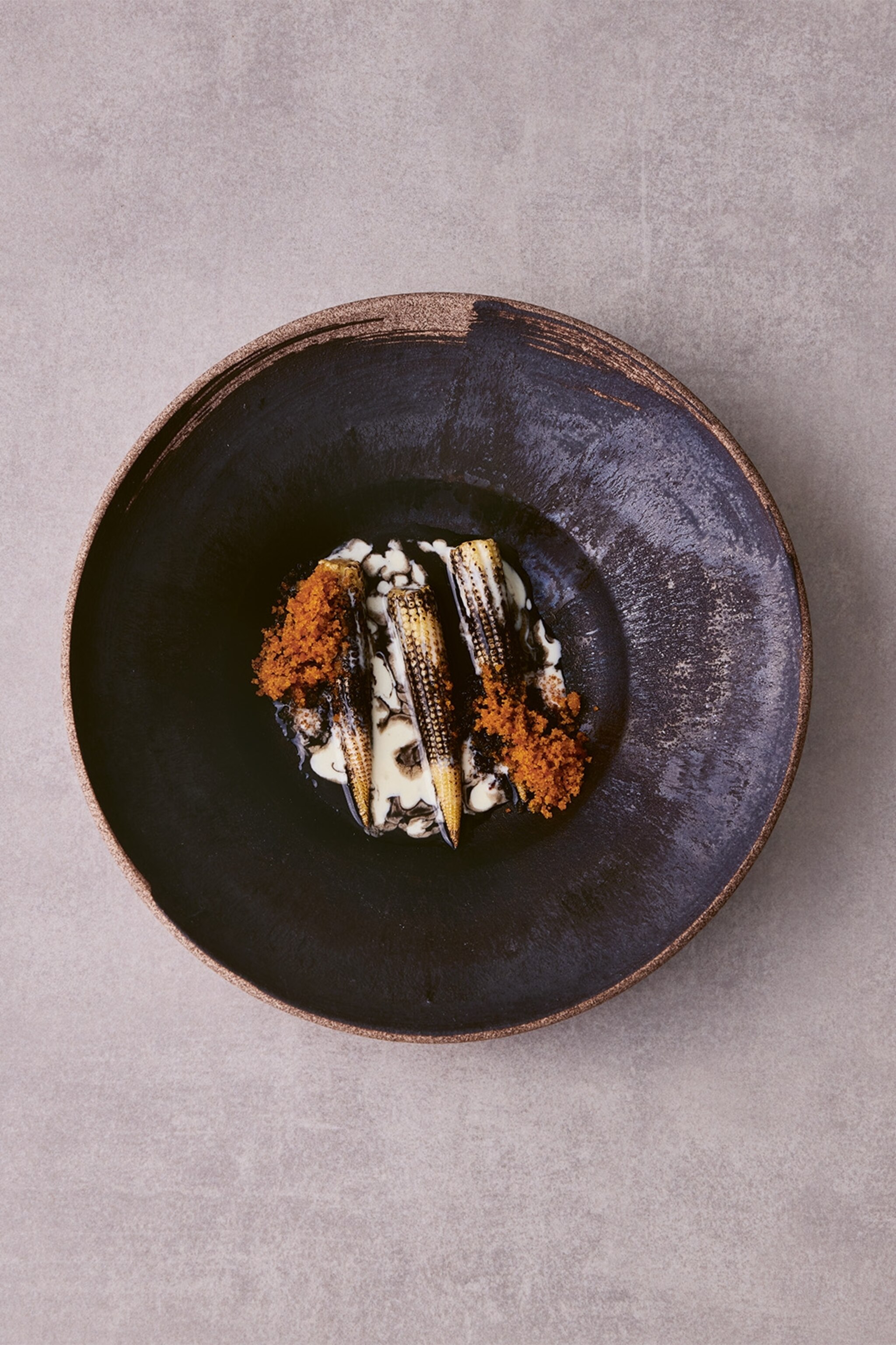 Baby corn, black garlic and bottarga.