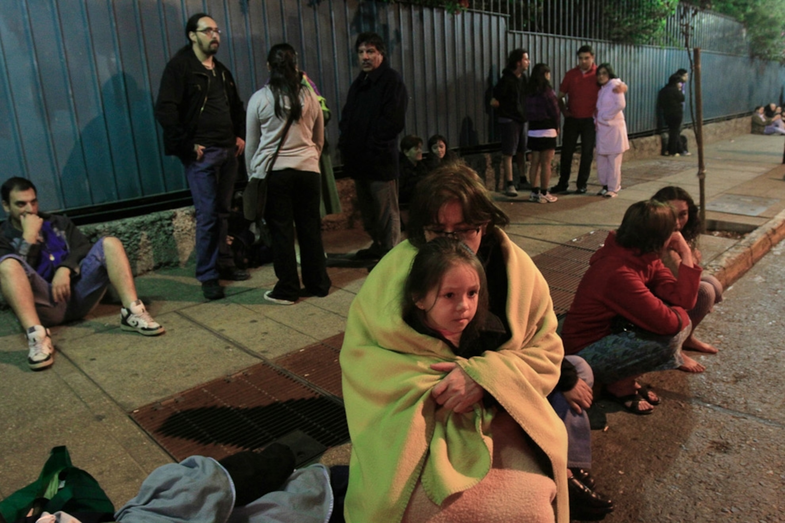 Survivors of the February 27, 2010, Chile earthquake gather in the streets of downtown Santiago in this picture.