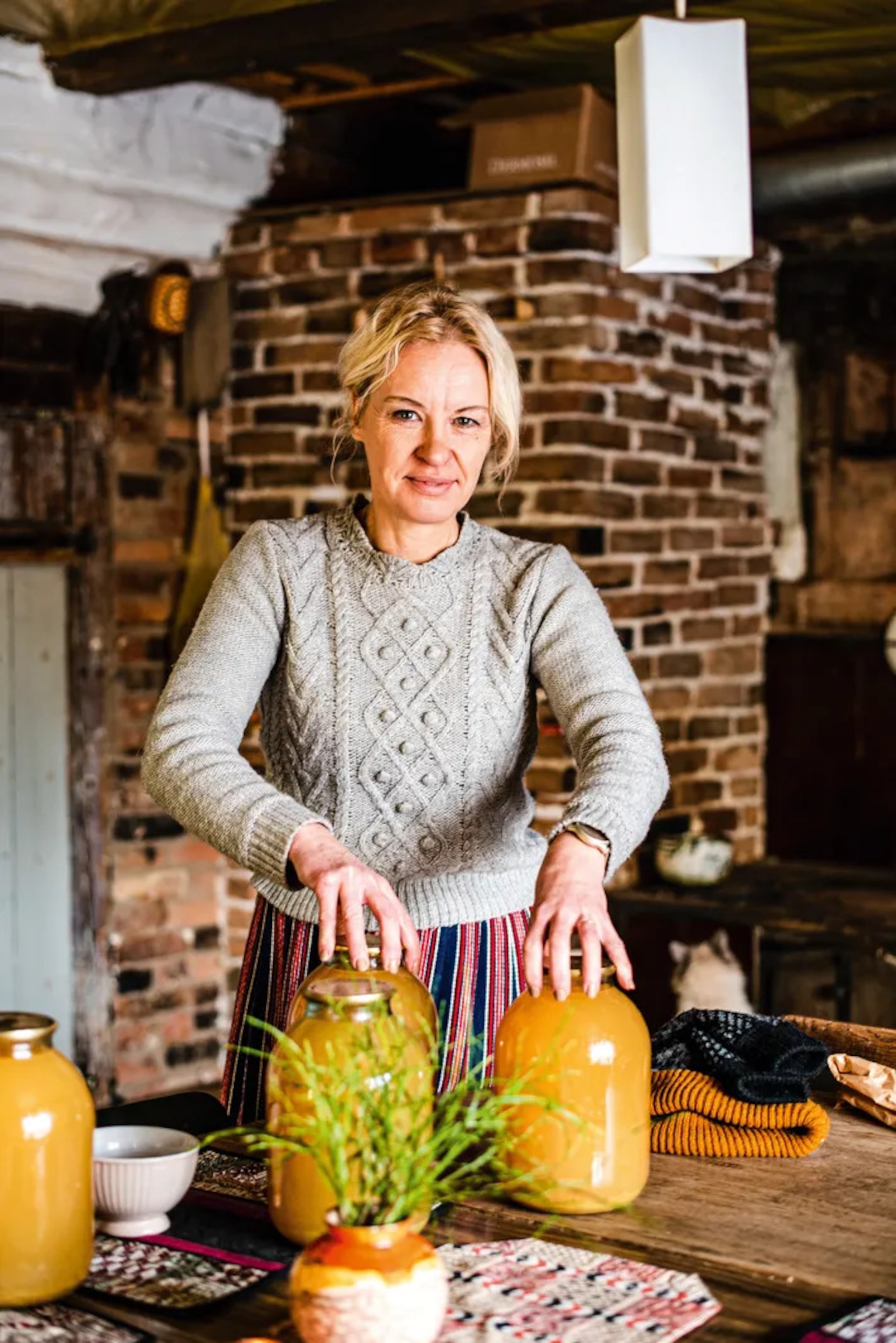 Egle Kõrvas with her jars of apple juice, which she makes every year from her crop of 20 or so apple trees.