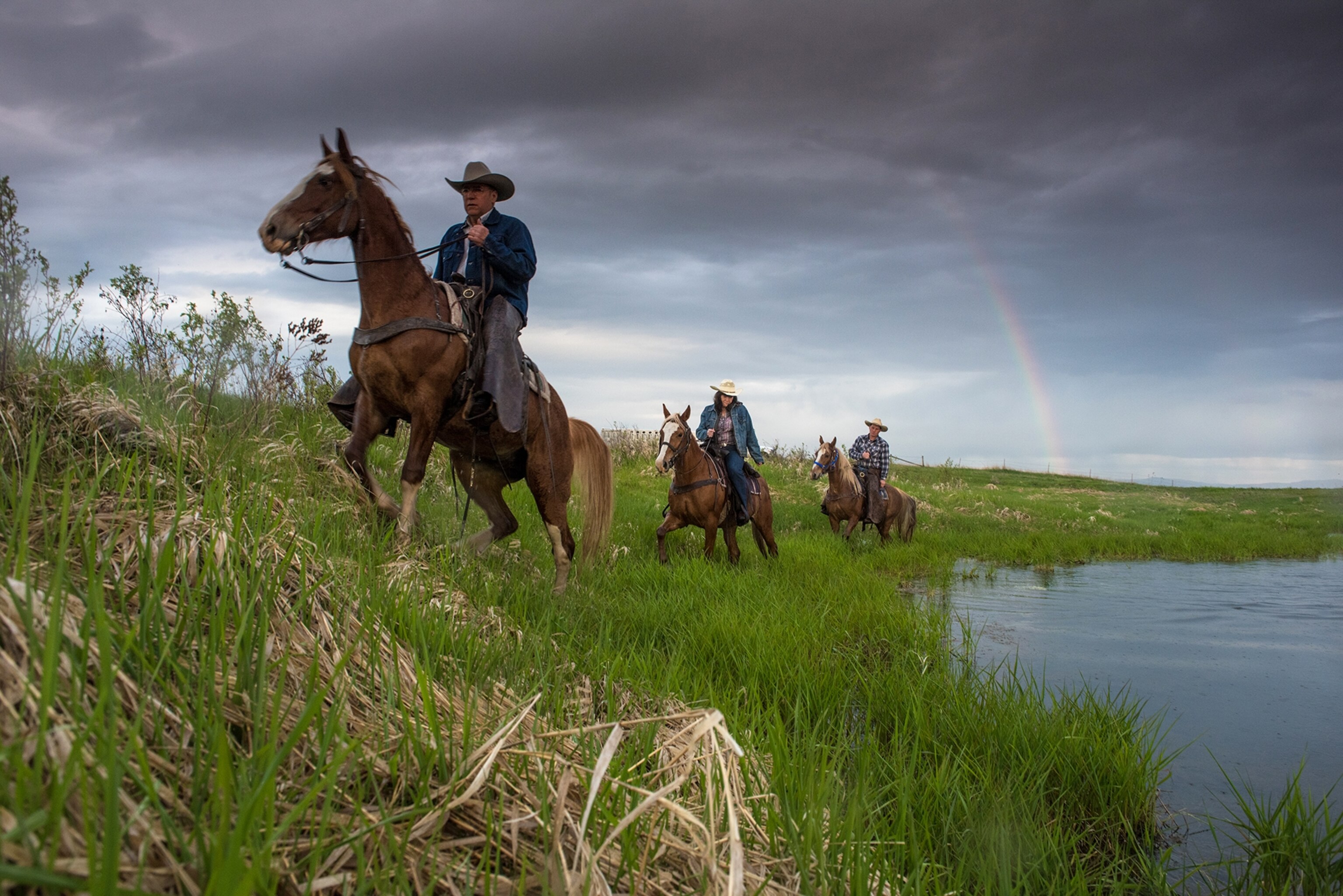 a rainbow during a sunrise ride around the Kicking Horse Reservoir in Montana