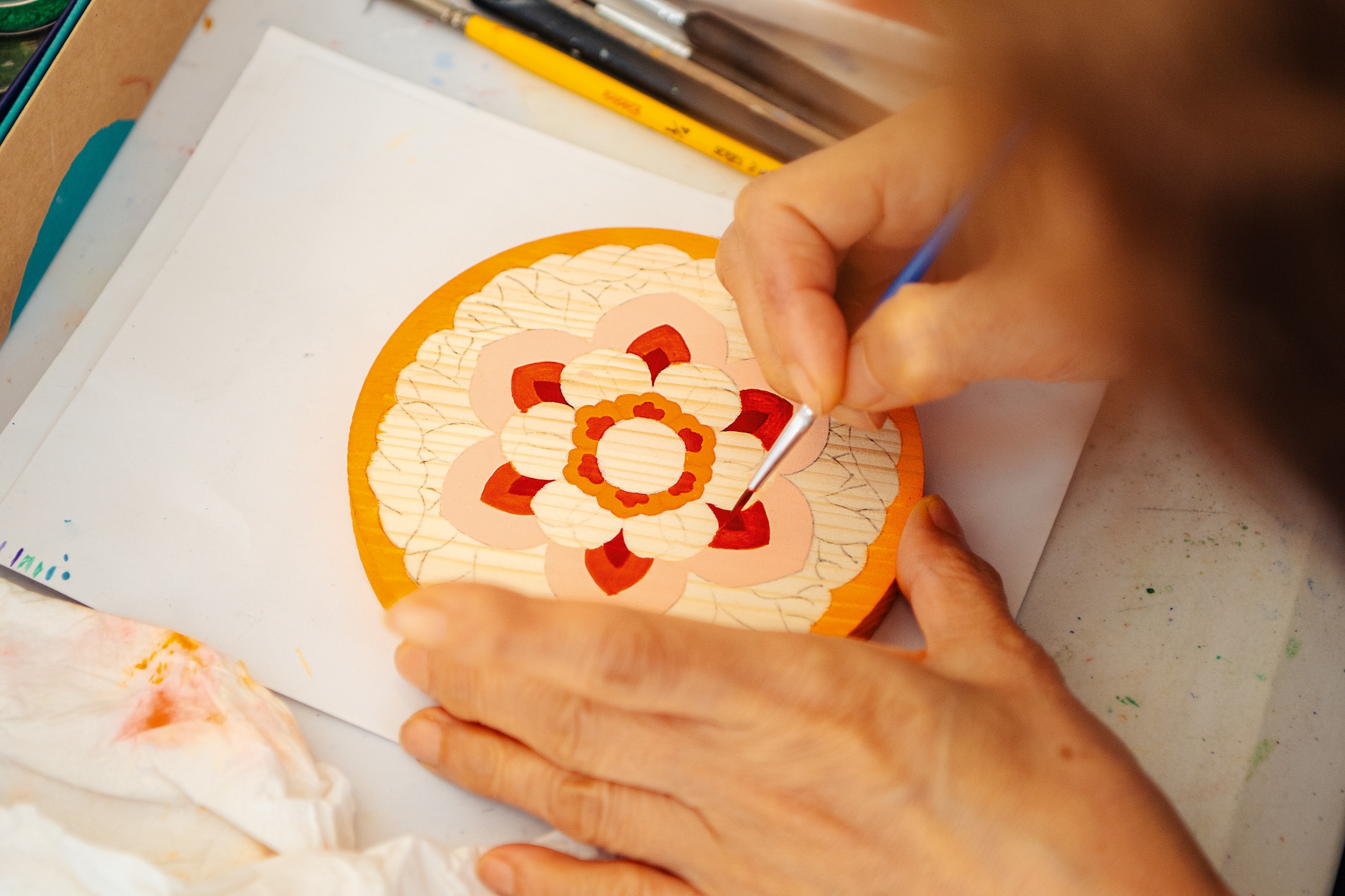 Lotus motif being painted.