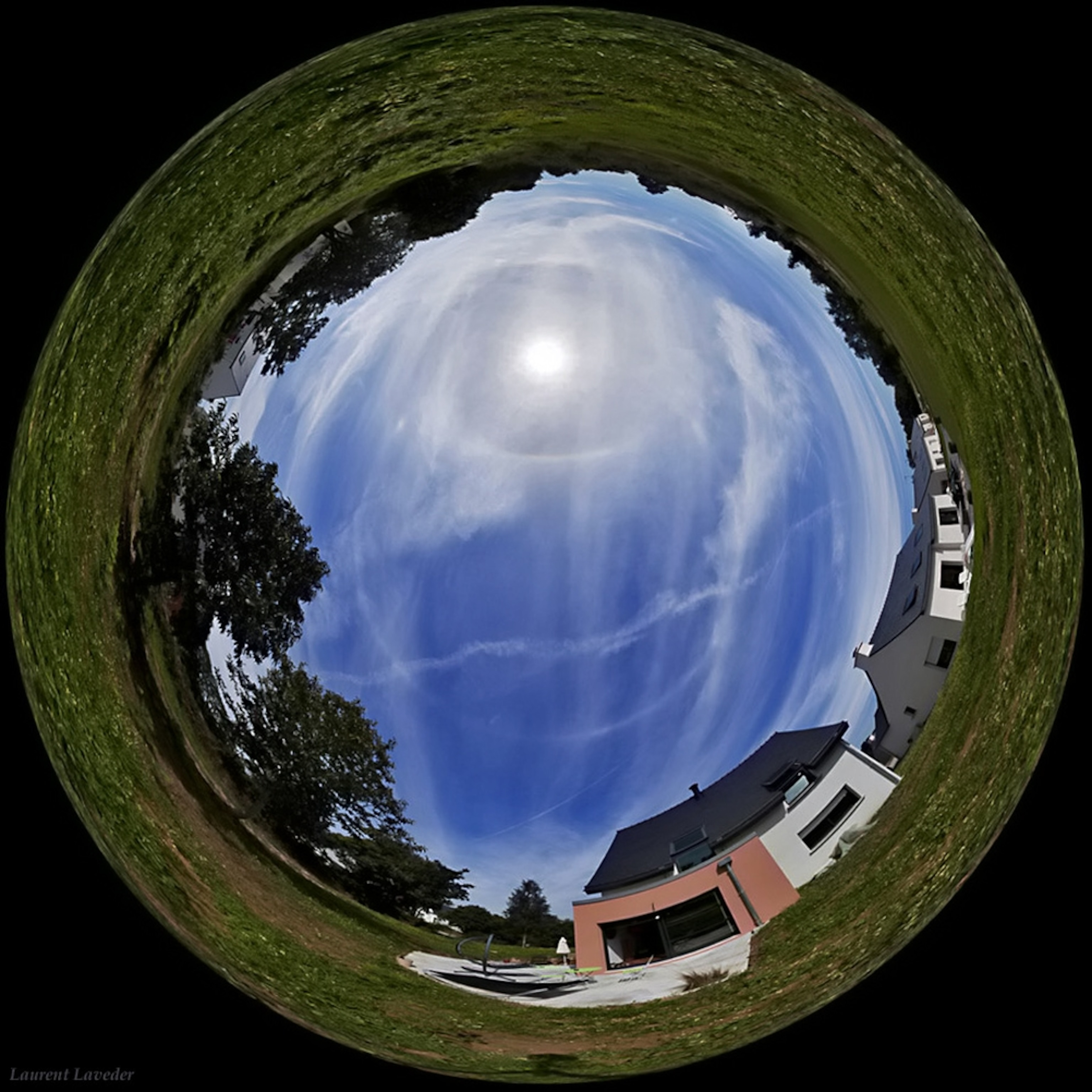 A 360-degree picture from Brittany, France, shows two atmospheric circles in the summer sky.