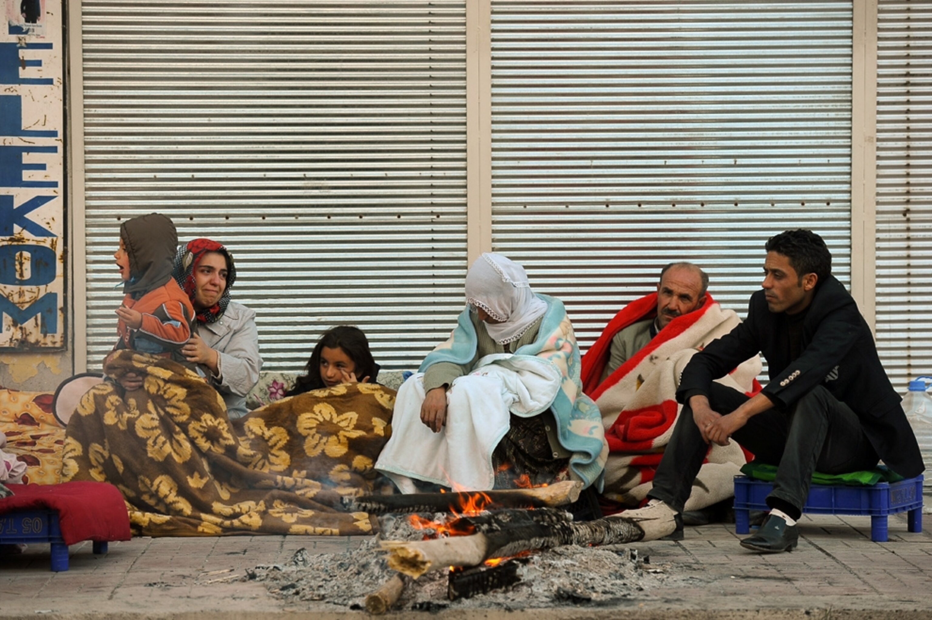 Turkey earthquake picture: Survivors sit on the street in Ercis