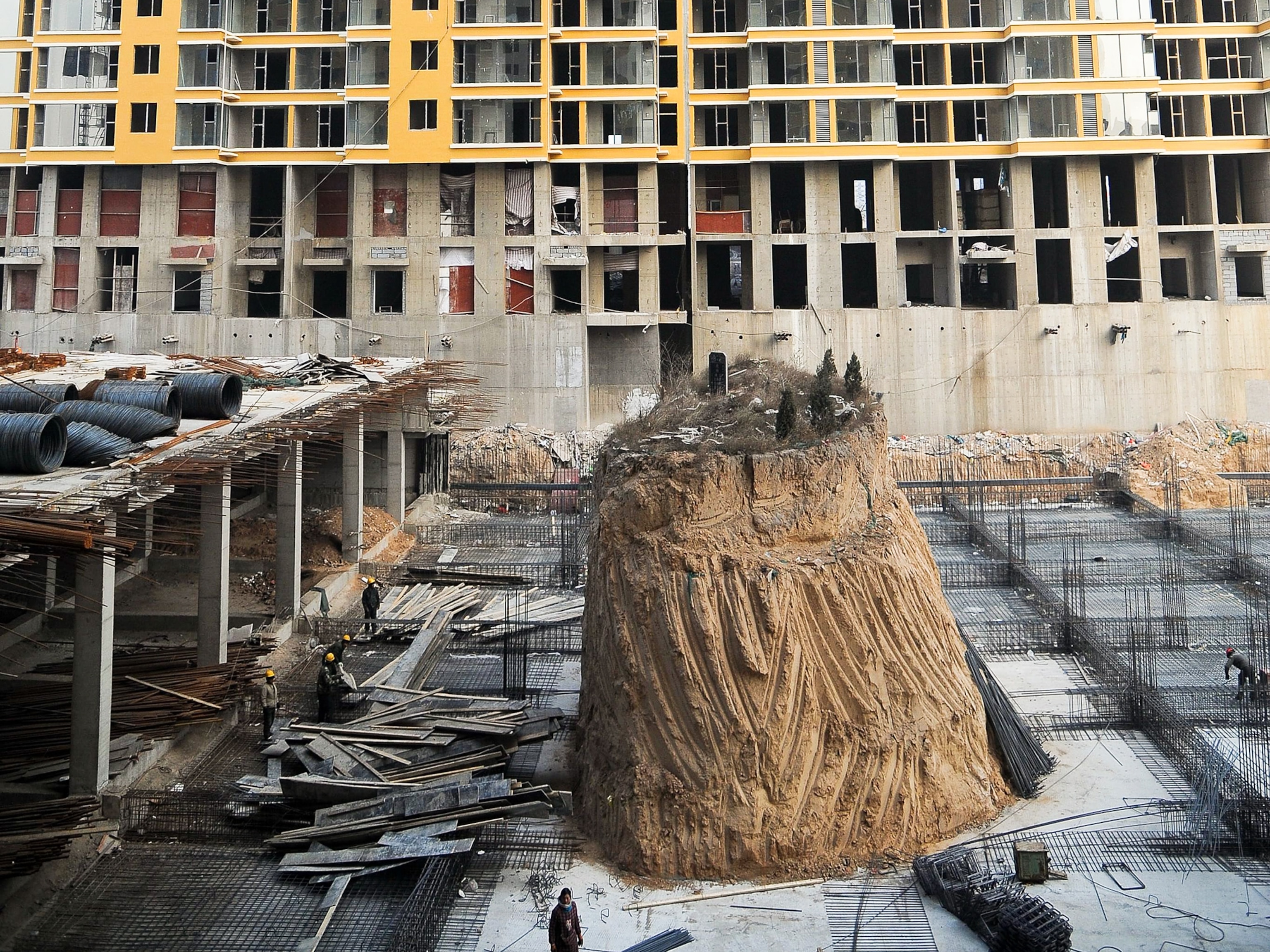 A tomb amidst a construction site.