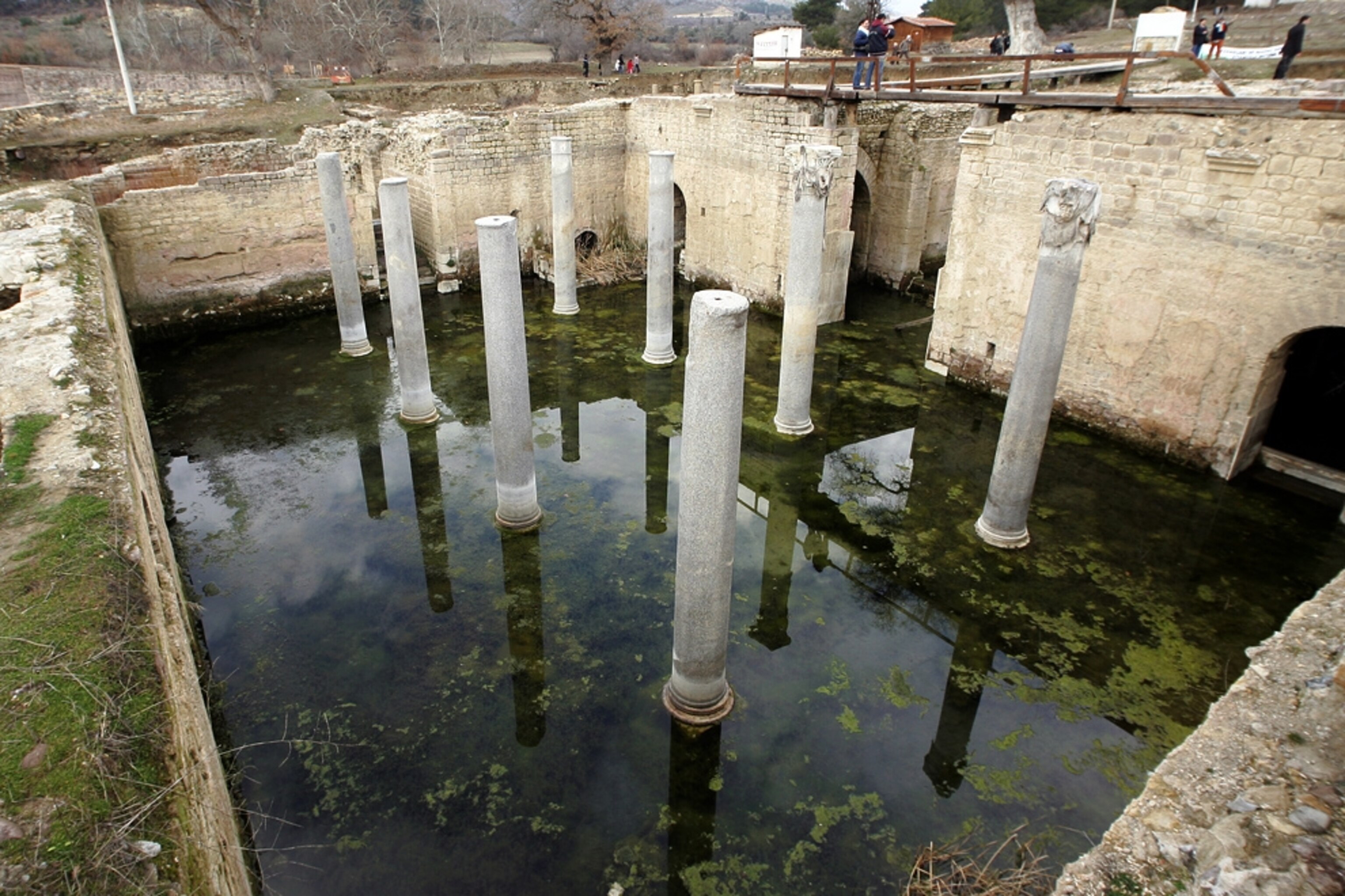 Columns rise from shallow water in the Roman ruins in Allianoi.