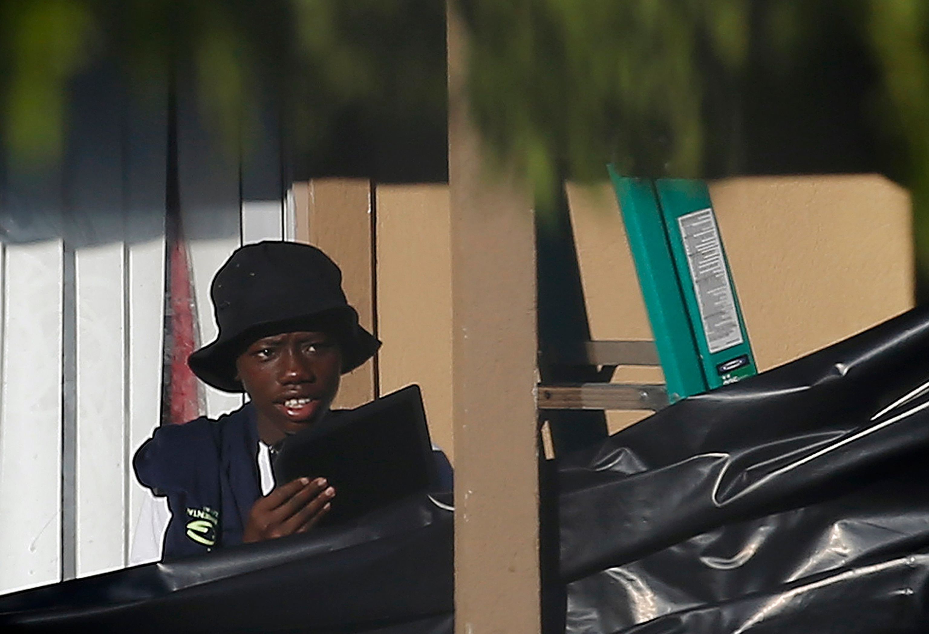 A nurse and a doctor for tropical medicine wearing isolation suits demonstrate the decontamination procedure as part of ebola treatment capability at Station 59 in Berlin, Germany.
