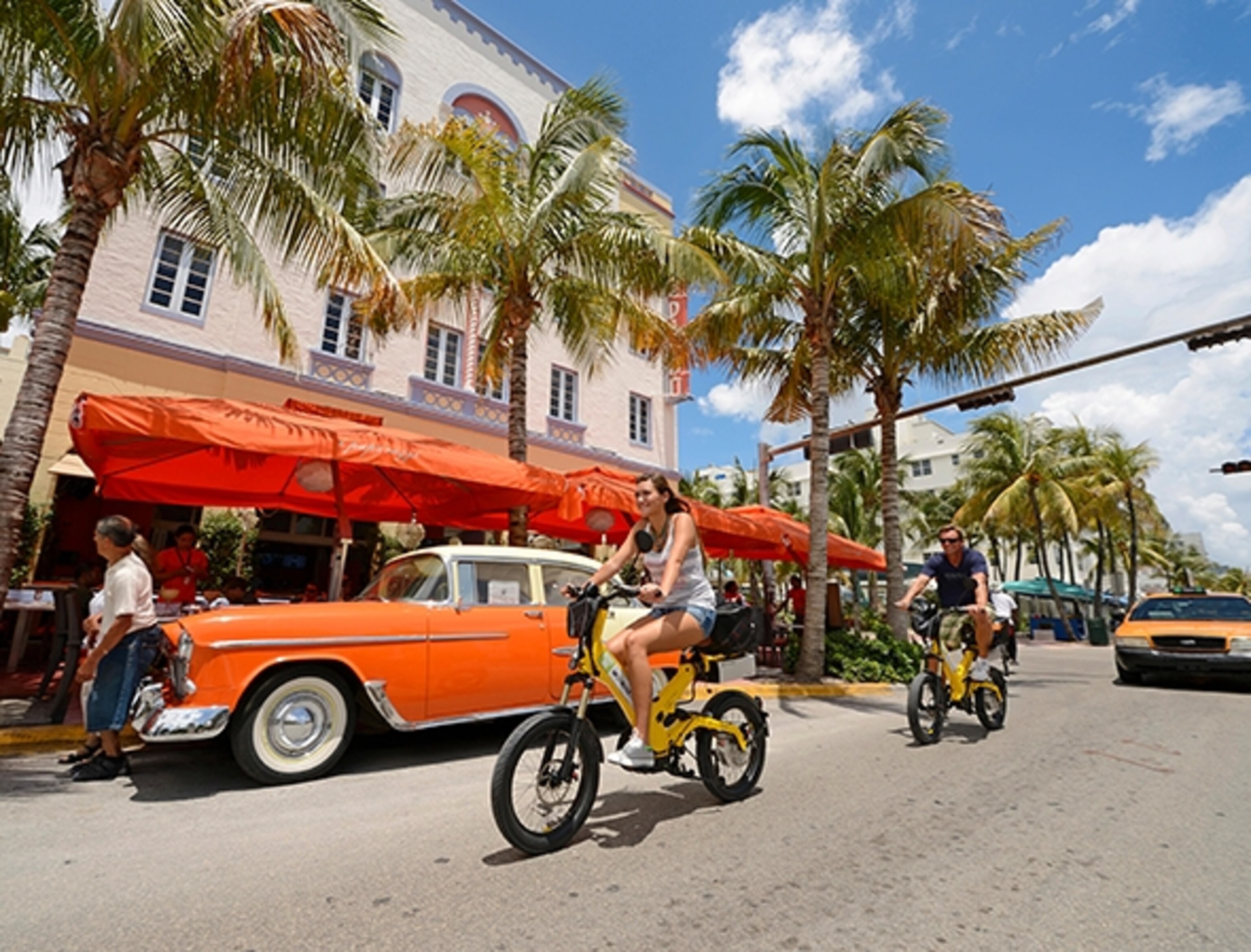 Bicyclists cruise down Ocean Drive in South Beach (Photograph by Norbert Eisele-Hein, Alamy)