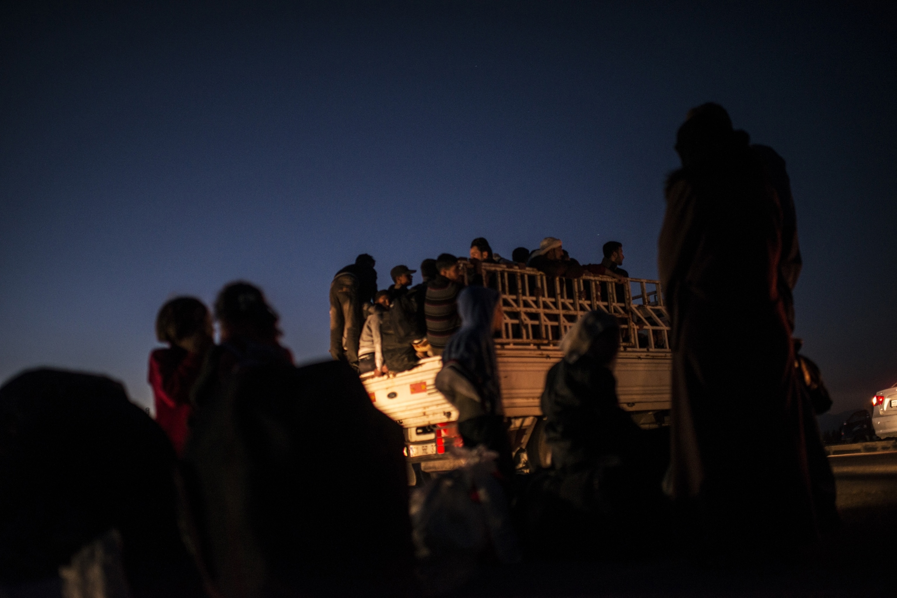 Syrian refugees cross into Turkey after the Muslim Holiday of Eid al-Adha through unofficial border crossings in villages around Reyhanli and Hacipasa in Turkey, October 20, 2013.