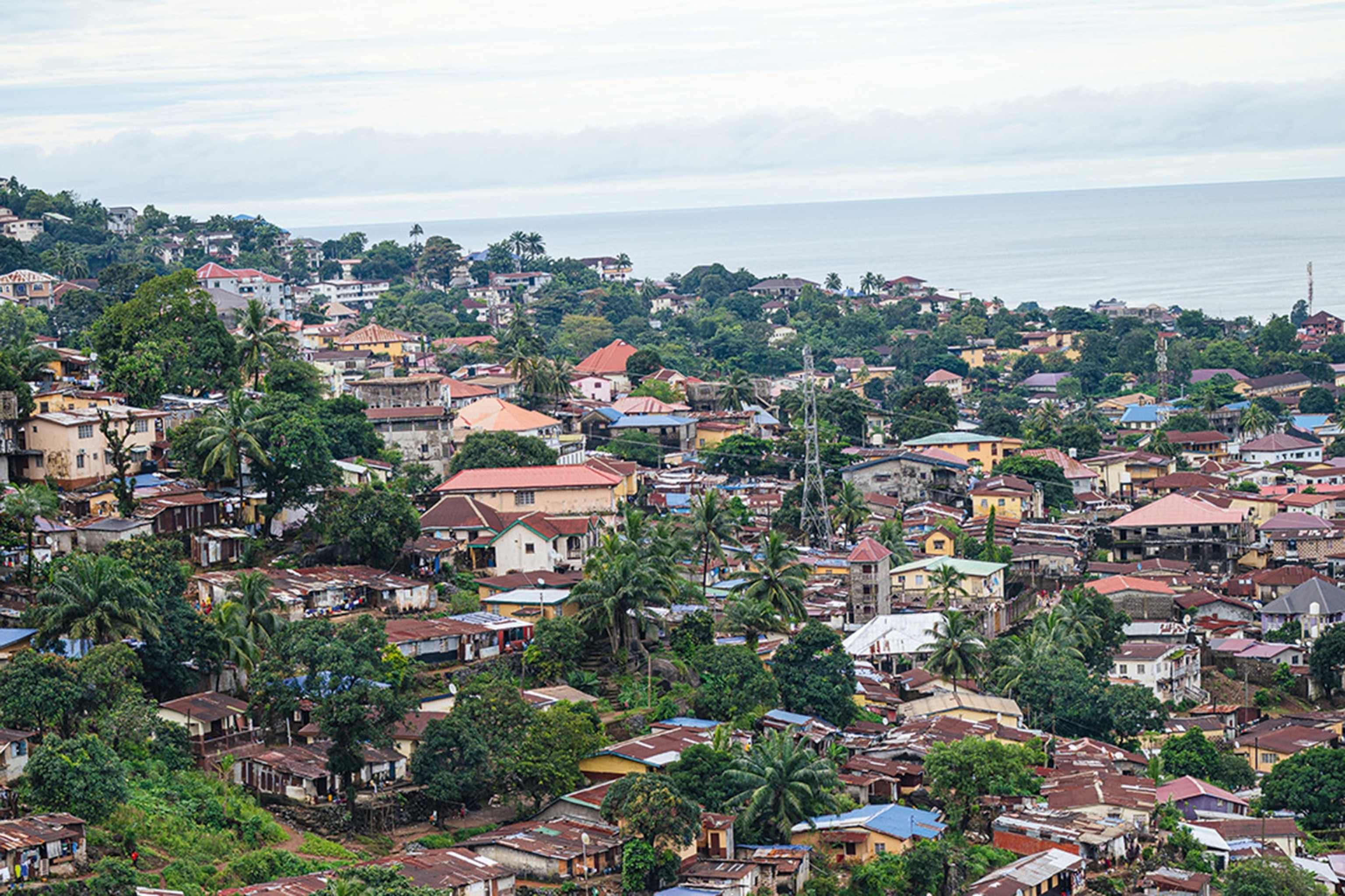 Freetown’s tightly bound neighbourhoods are bordered by the Atlantic Ocean and the forested slopes of the Freetown Peninsula