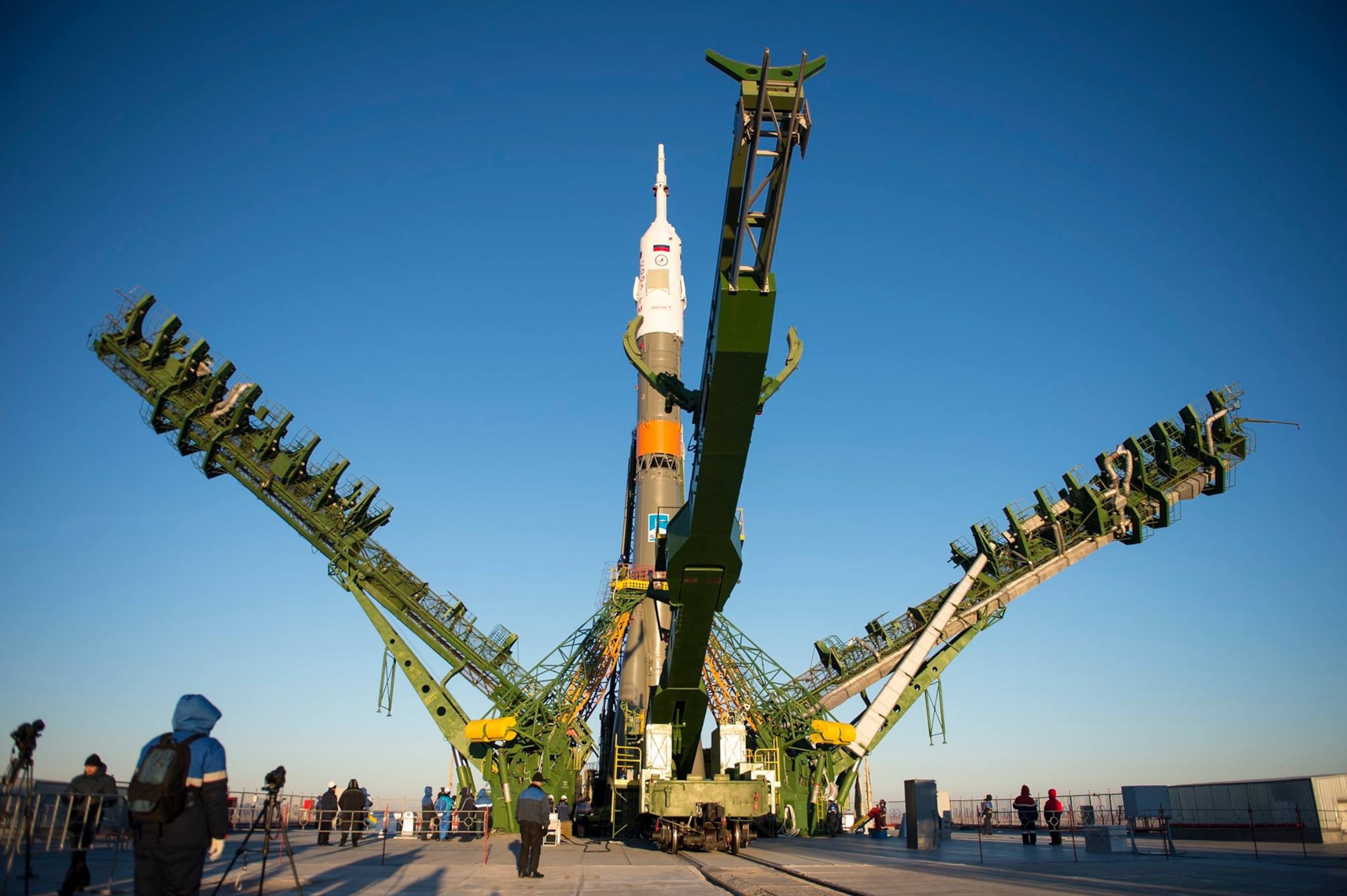 The gantry arms close around the Soyuz TMA-15M spacecraft to secure the rocket at the launch pad at the Baikonur Cosmodrome on November 21, 2014 in Baikonur, Kazakhstan.