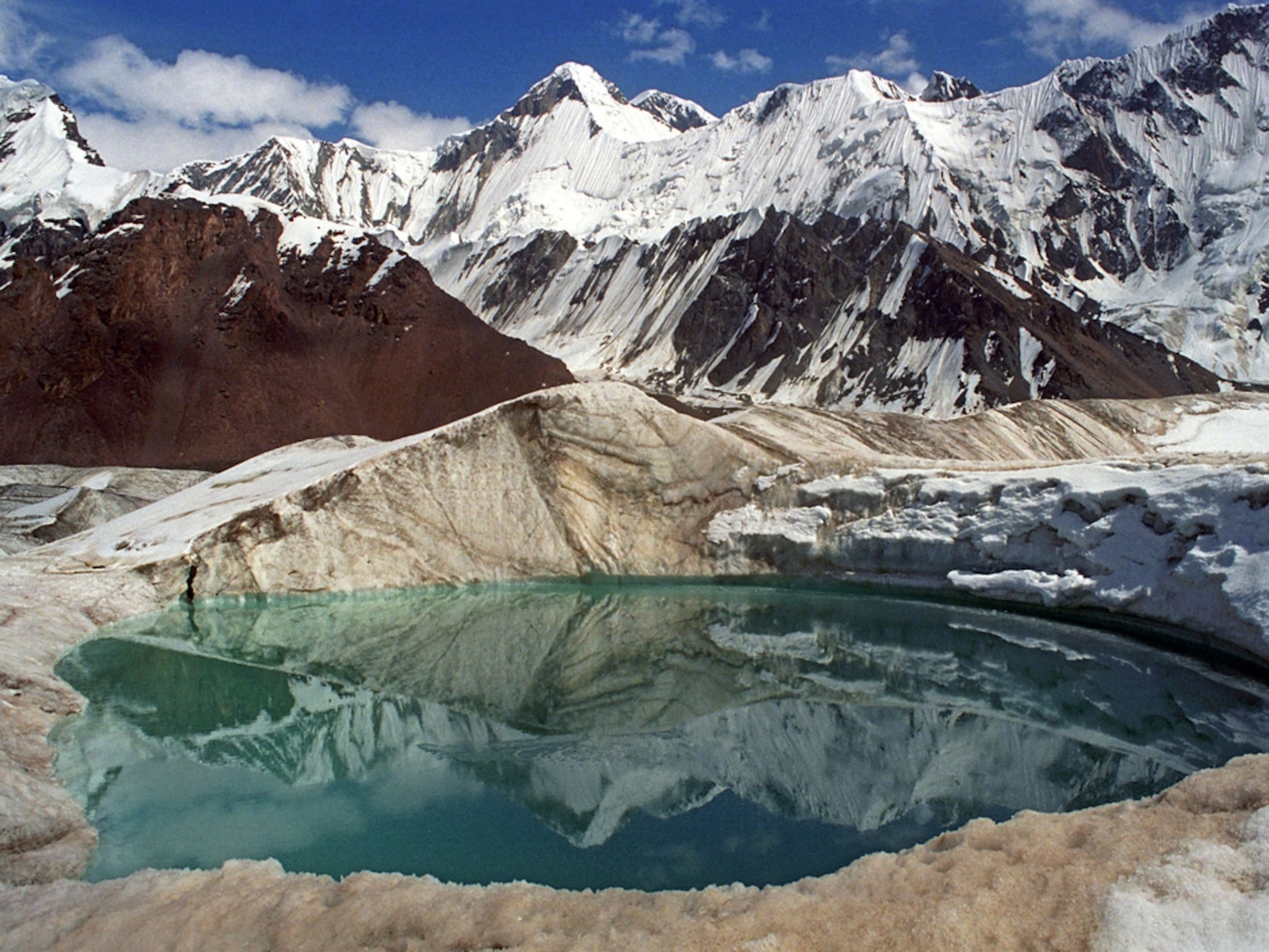A lake surrounded by mountain peaks