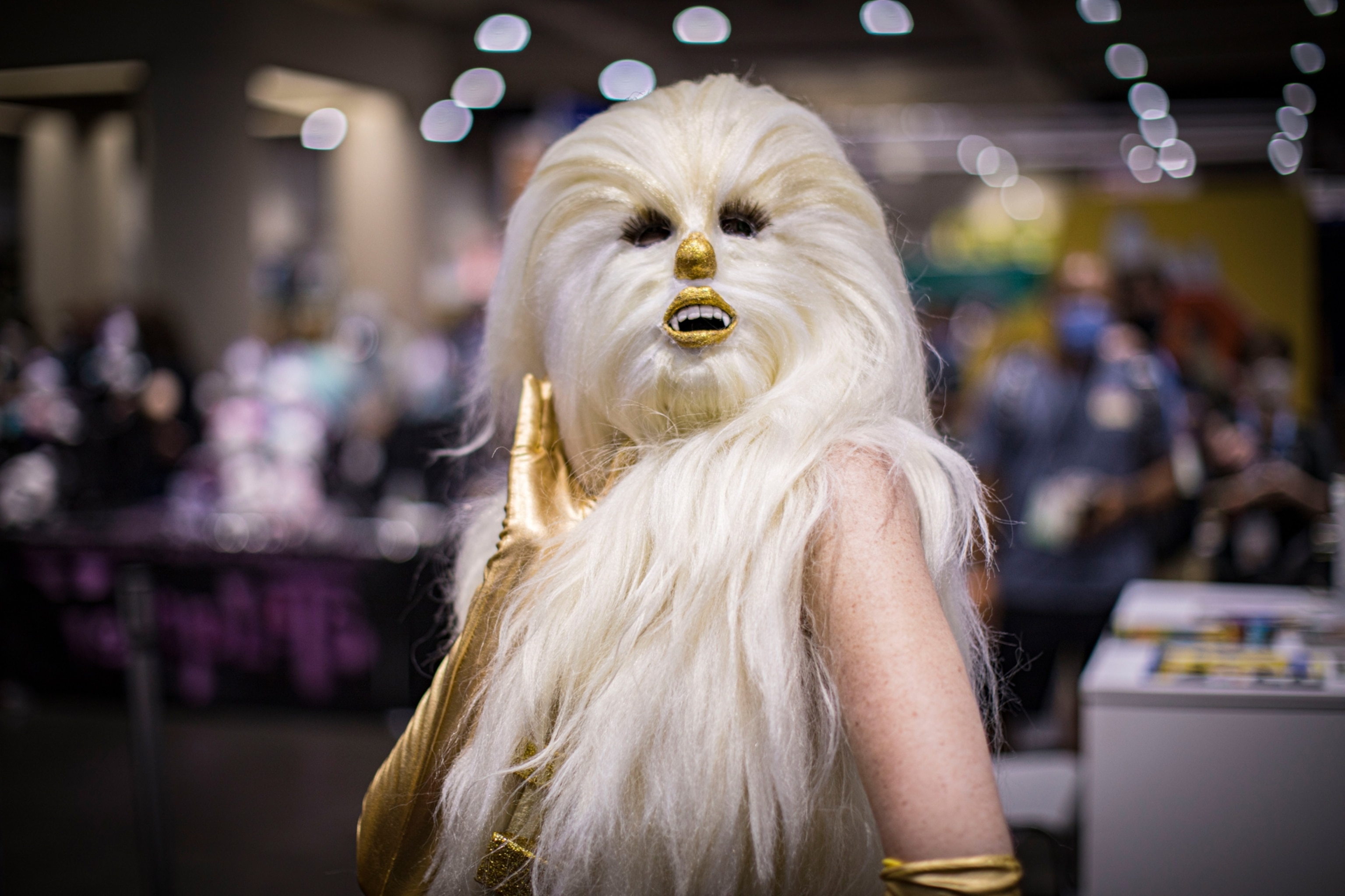A cosplayer posing in a Chewbacca mask