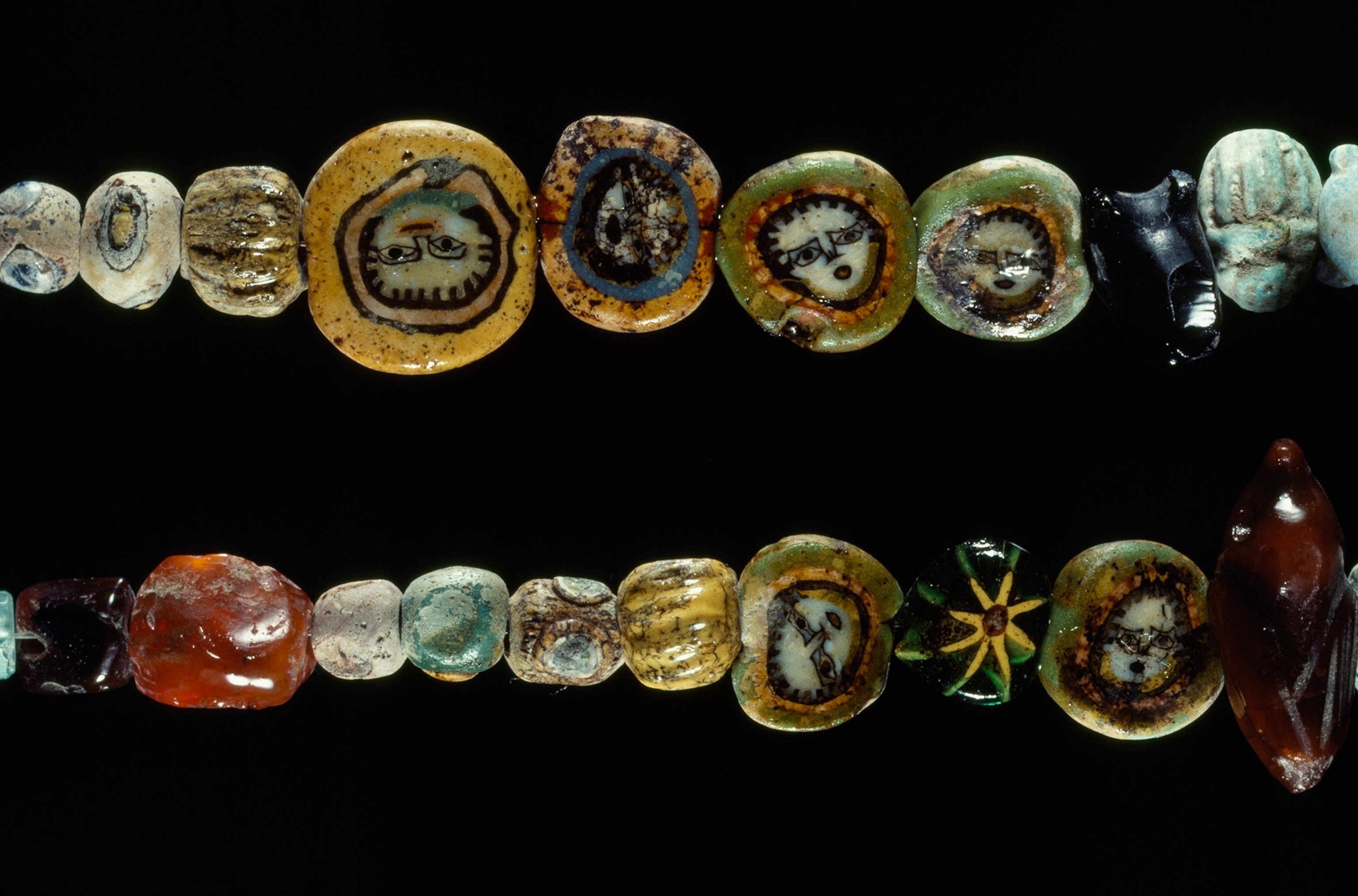 Gorgon heads adorn ancient beads from a necklace found at Herculaneum.