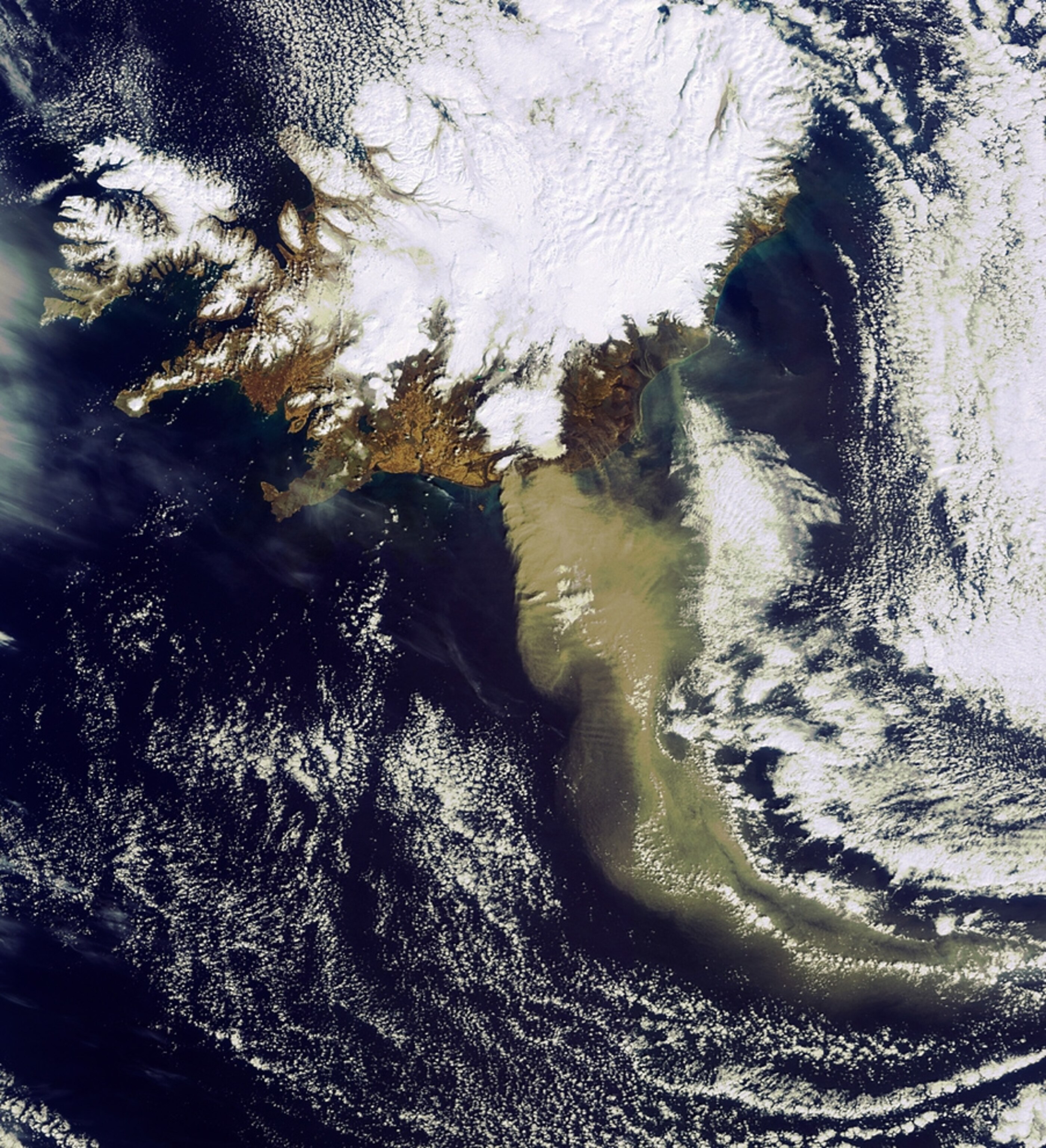 A new satellite picture shows the ash plume curving away from Iceland's Eyjafjallajökull volcano.