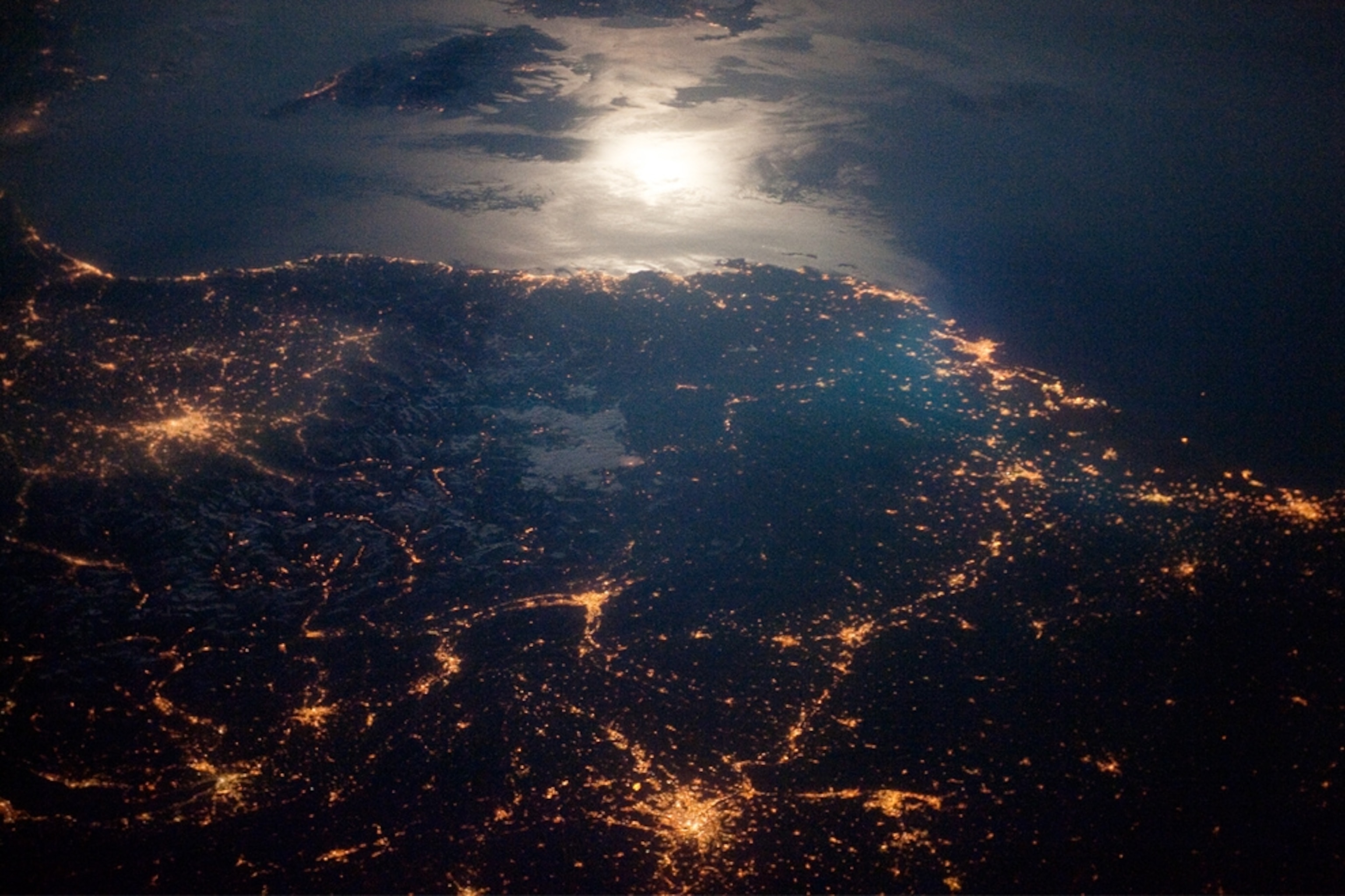 An astronaut's picture of city lights along the France-Italy border at night.
