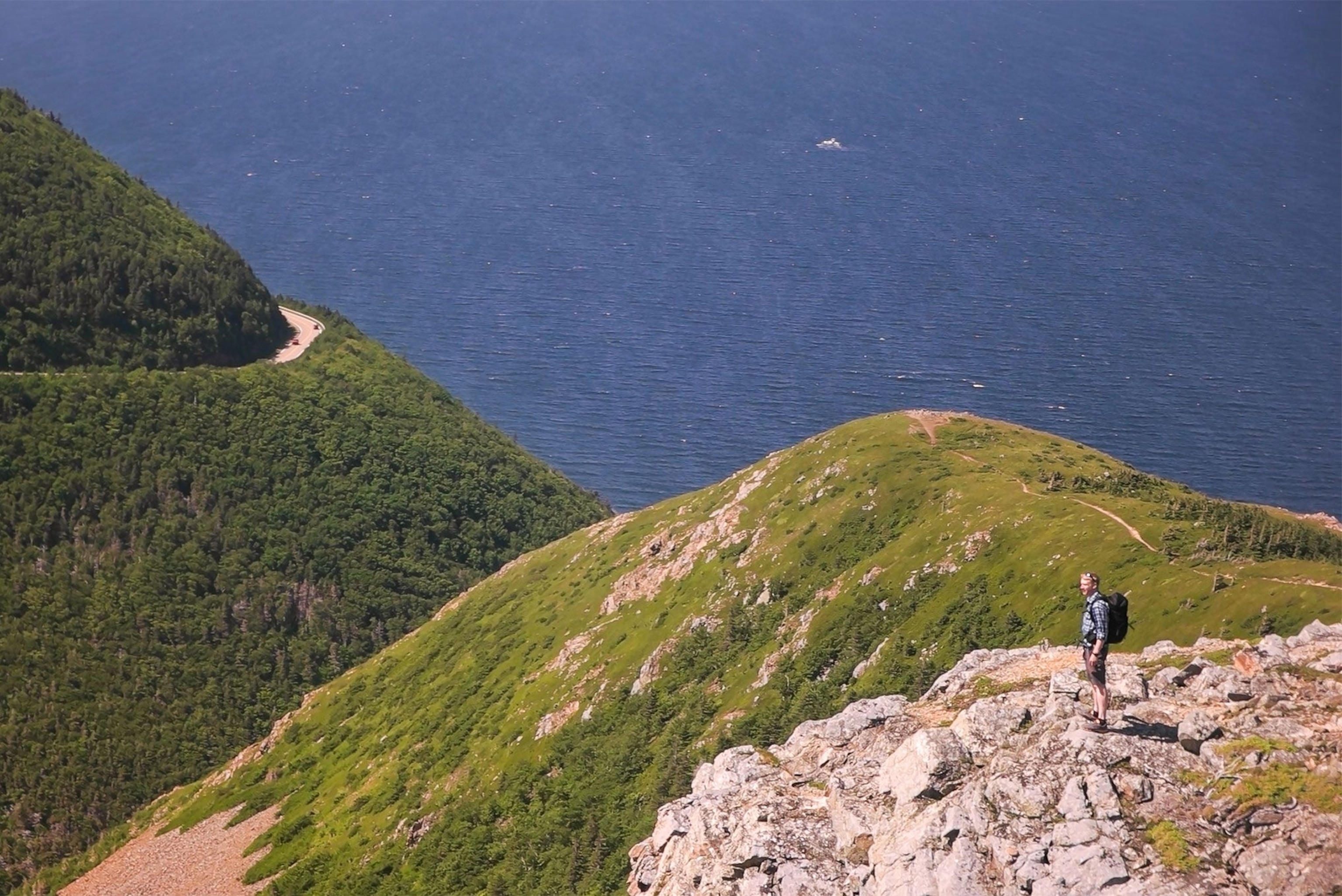 a person hiking along the skyline trail of Cape Breton Highlands National Park.