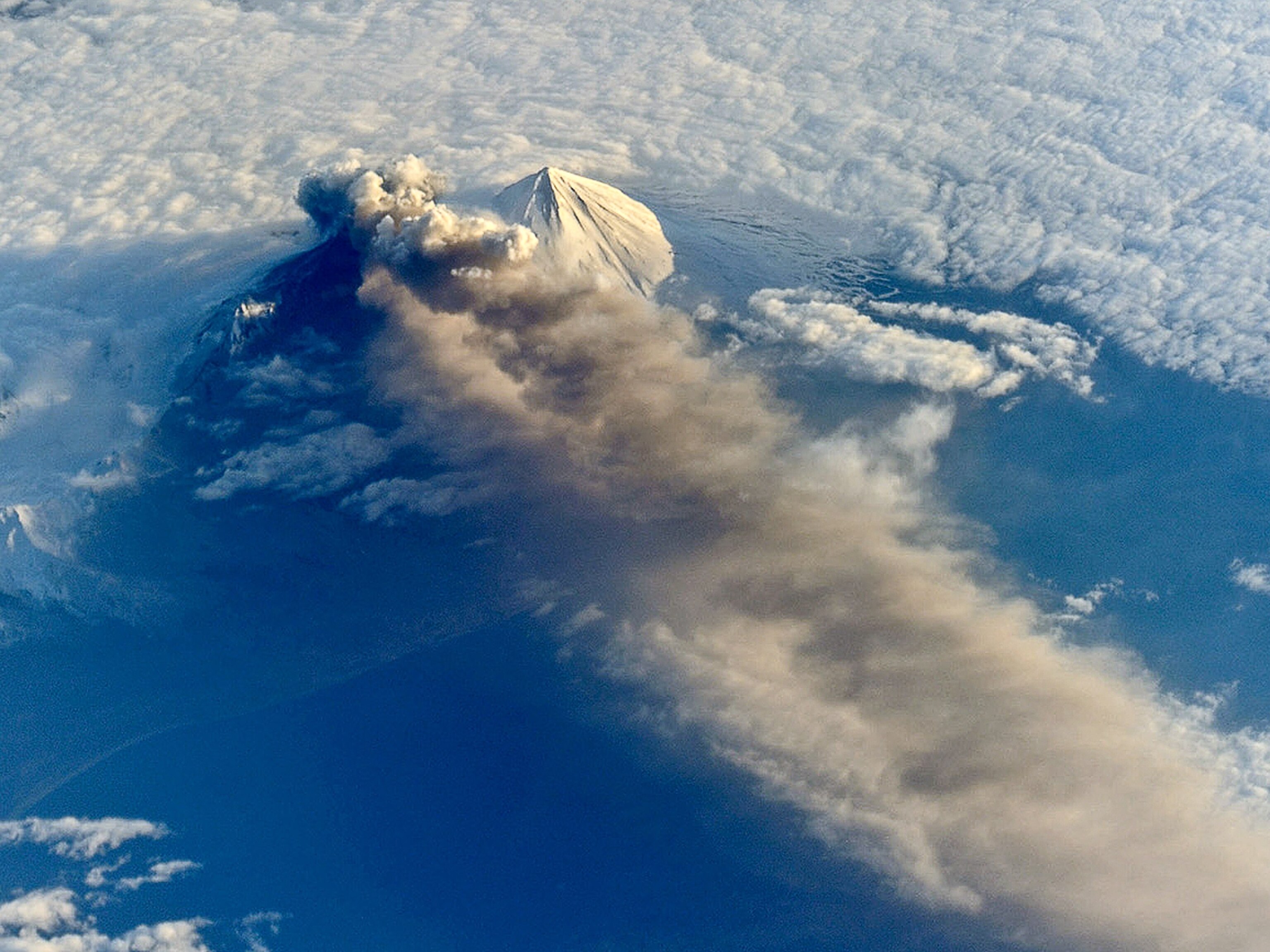Week in Space - Picture of the Pavlof volcano, as seen from space, emitting a plume of ash