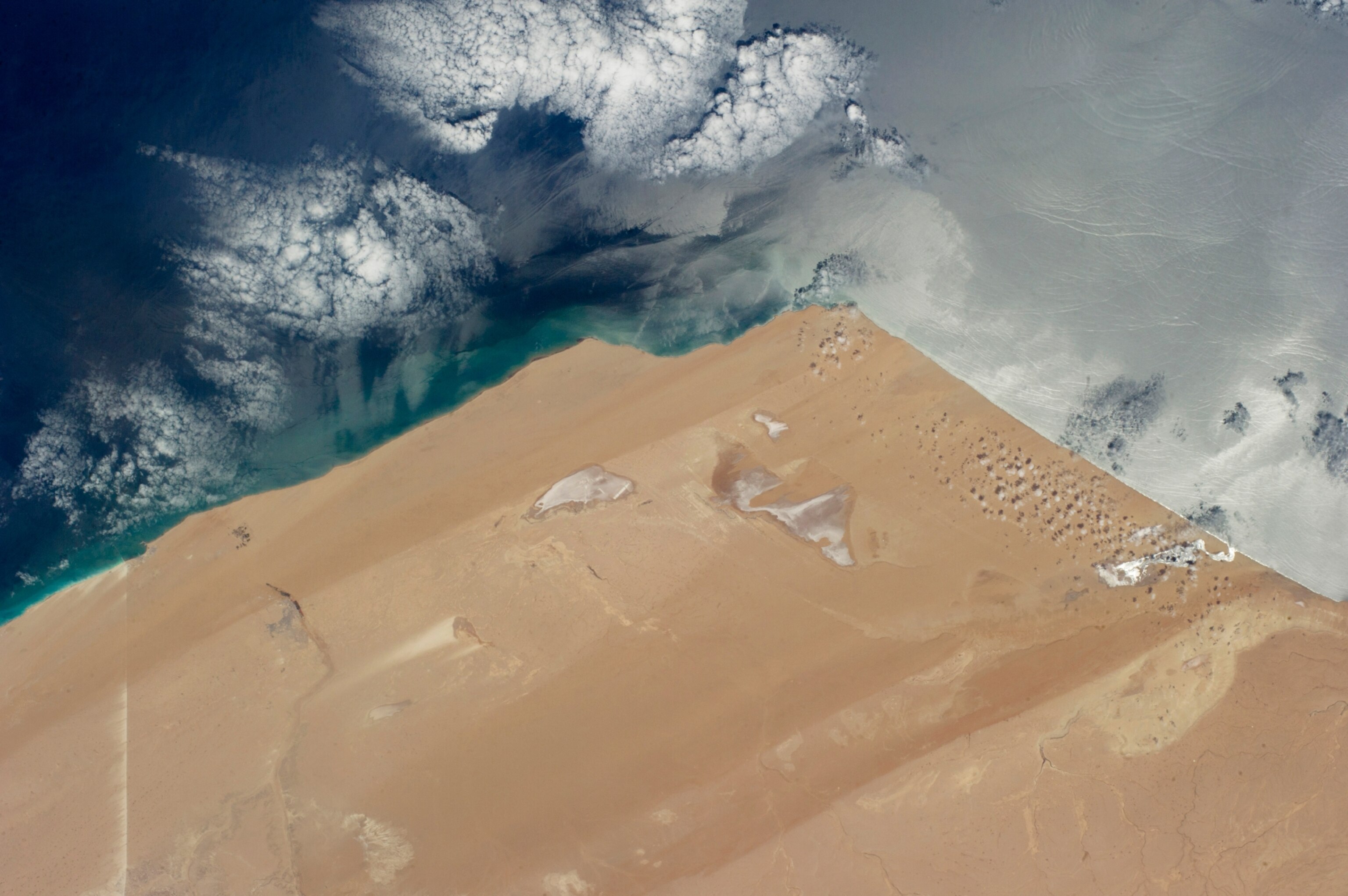 Astronaut image of the extremely arid West African coast of the Atlantic Ocean.