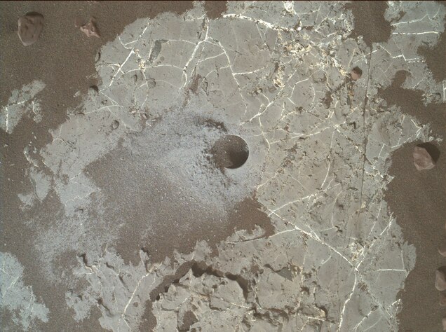 A drill hole on the surface of Mars.
